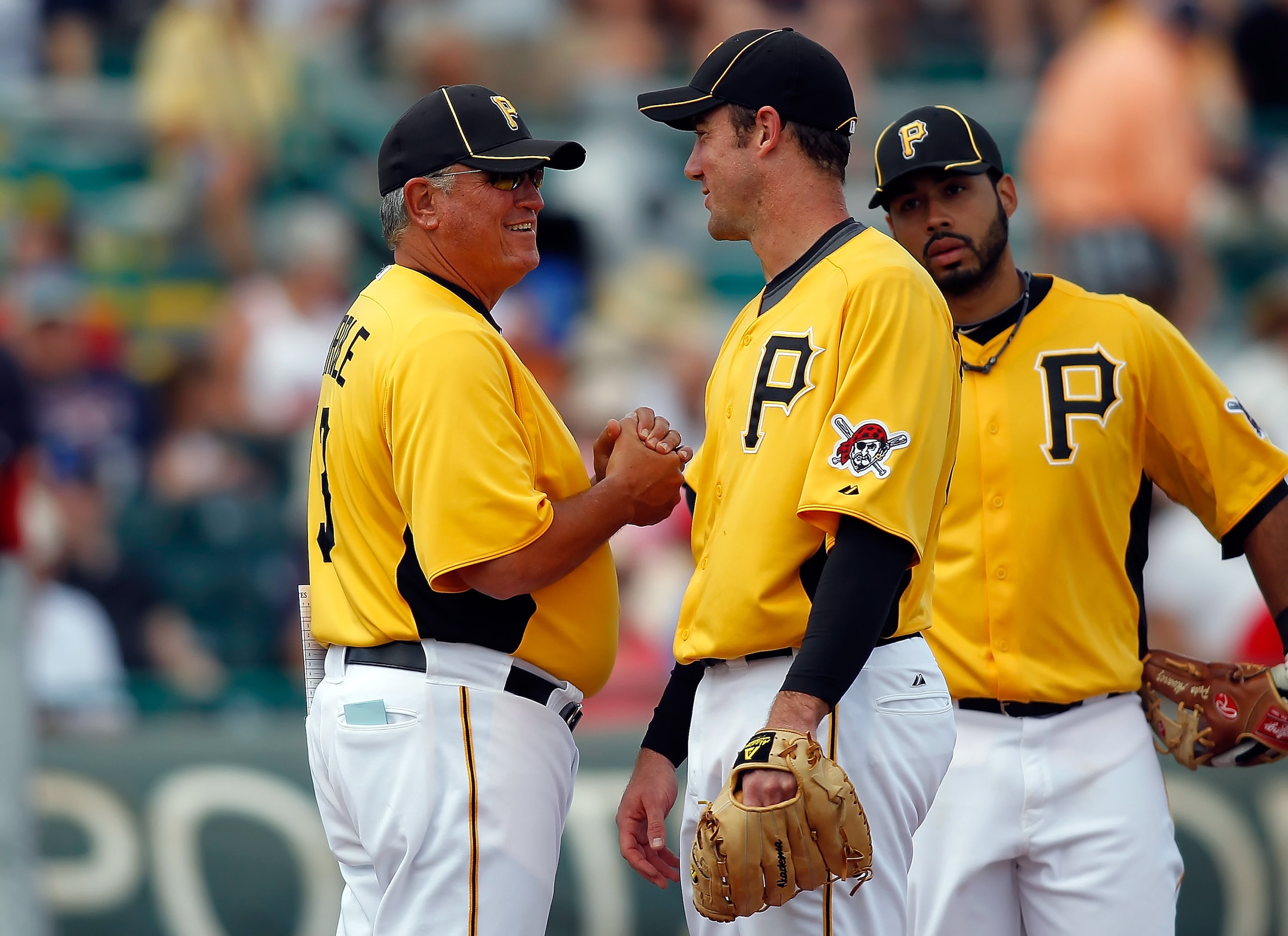 BRADENTON, FL - MARCH 02:  Manager Clint Hurdle #13 of the Pittsburgh Pirates removes pitcher Ross Ohlendorf #49 during a Grapefruit League Spring Training Game against the Minnesota Twins at McKechnie Field on March 2, 2011 in Bradenton, Florida.  (Photo