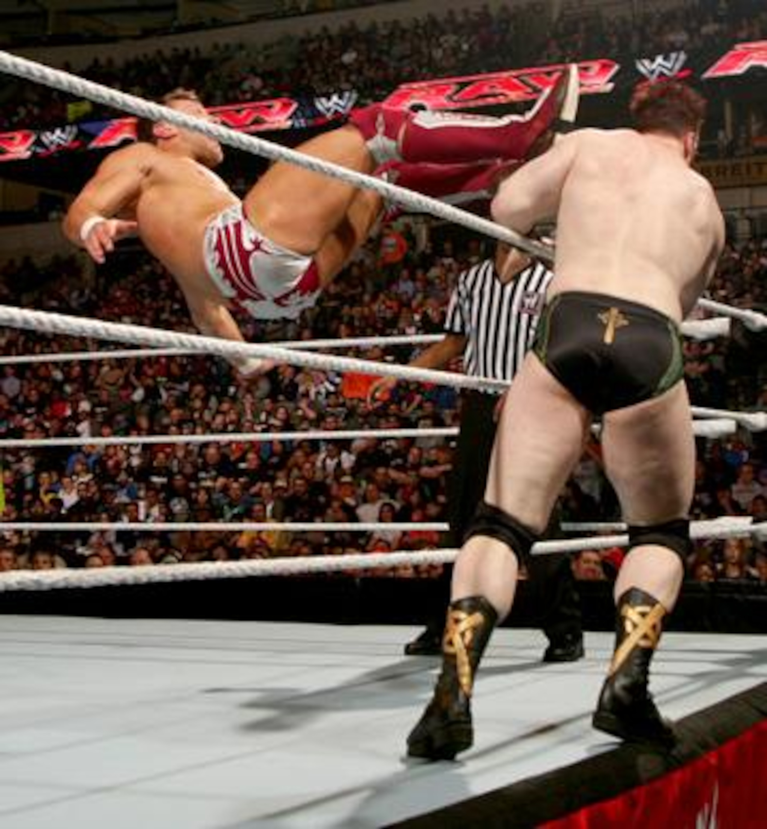 Sheamus getting kicked off the apron by Daniel Bryan