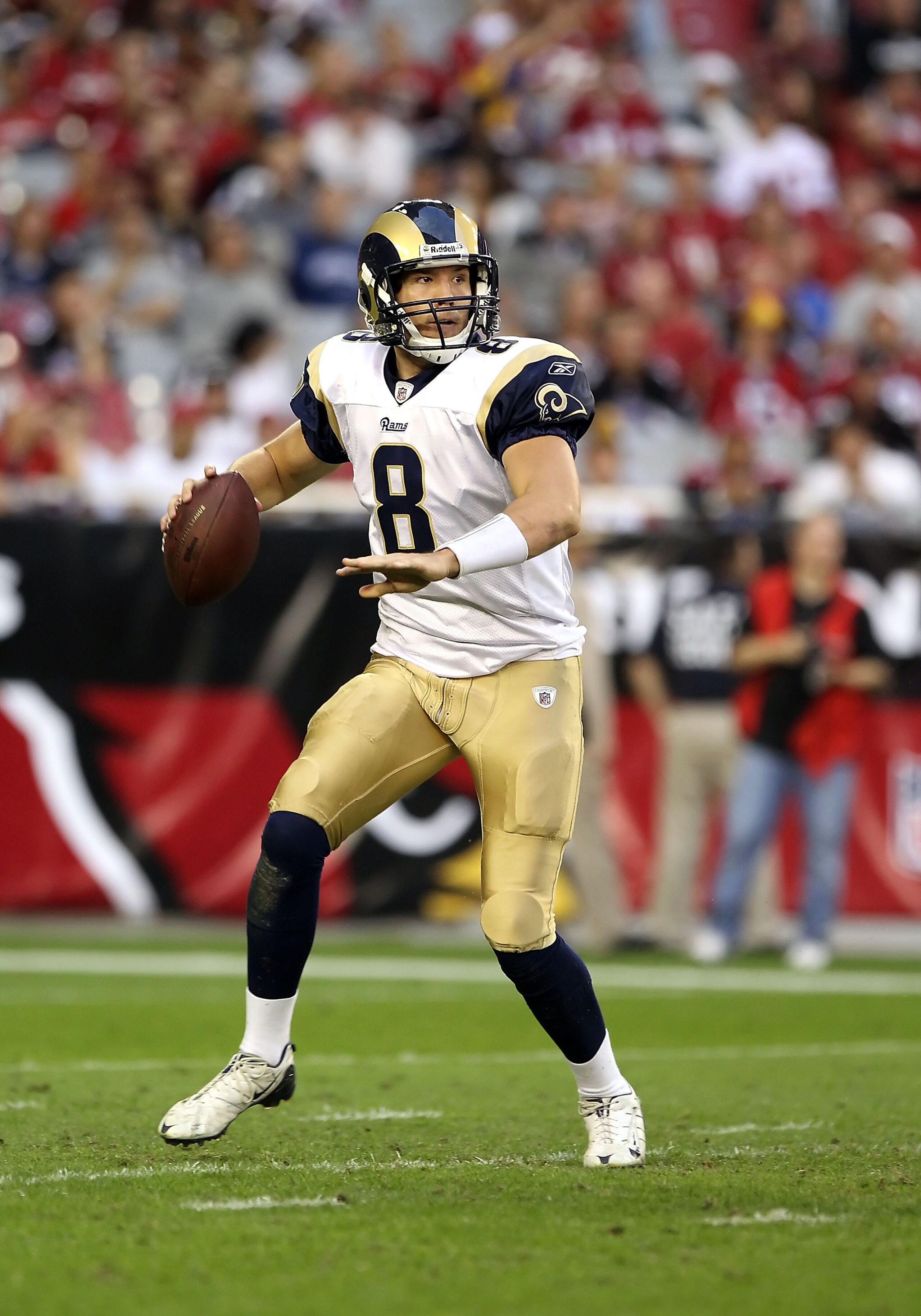 GLENDALE, AZ - DECEMBER 05:  Quarterback Sam Bradford #8 of the St. Louis Rams scrambles with the football during the NFL game against the Arizona Cardinals at the University of Phoenix Stadium on December 5, 2010 in Glendale, Arizona. The Rams defeated t