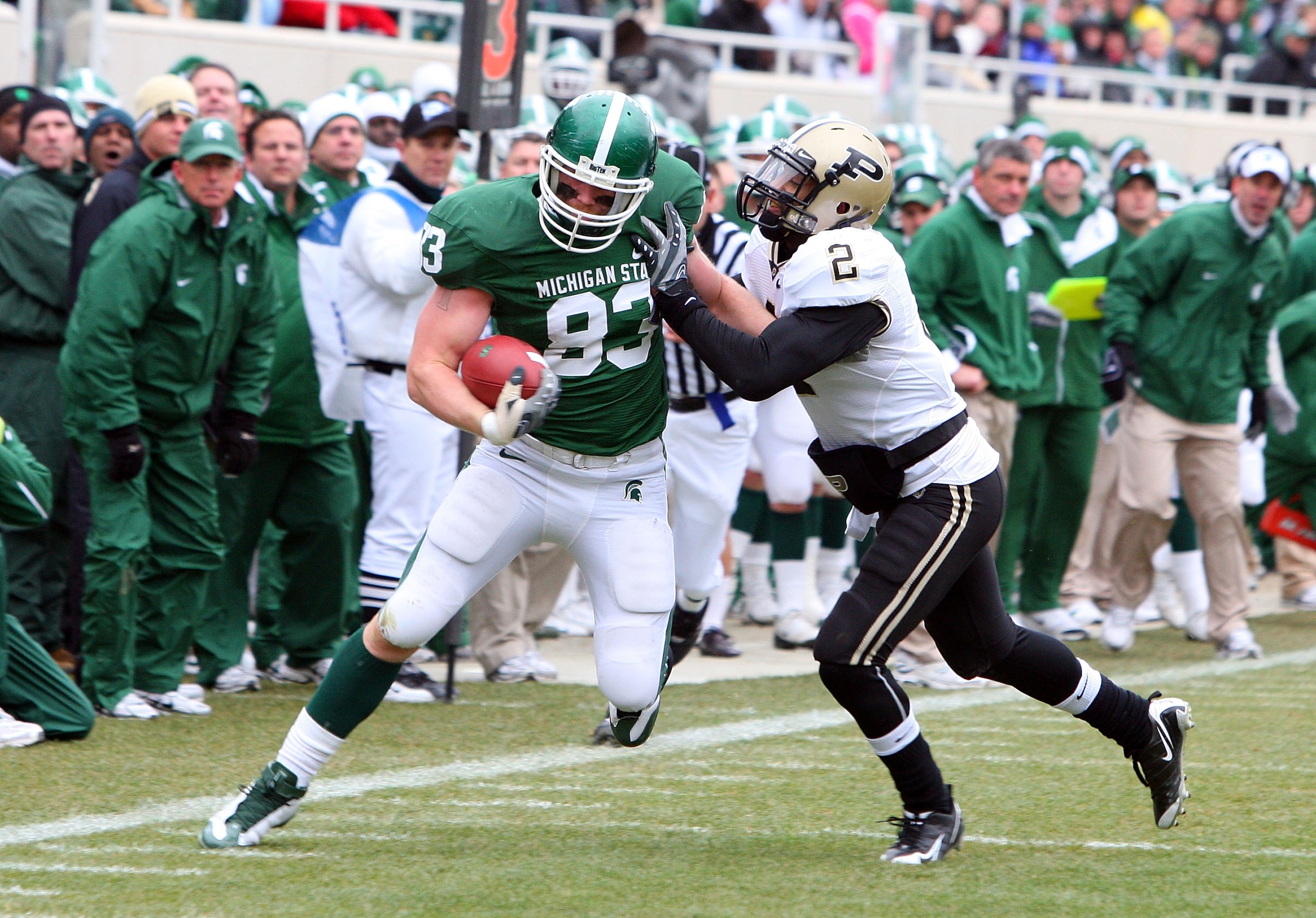 EAST LANSING, MI - NOVEMBER 08:  Charlie Gantt #83 of the Michigan State Spartans runs the ball against Torri Williams #2 of the Purdue Boilermakers at Spartan Stadium on November 8, 2008 in East Lansing, Michigan.  (Photo by Jim McIsaac/Getty Images)