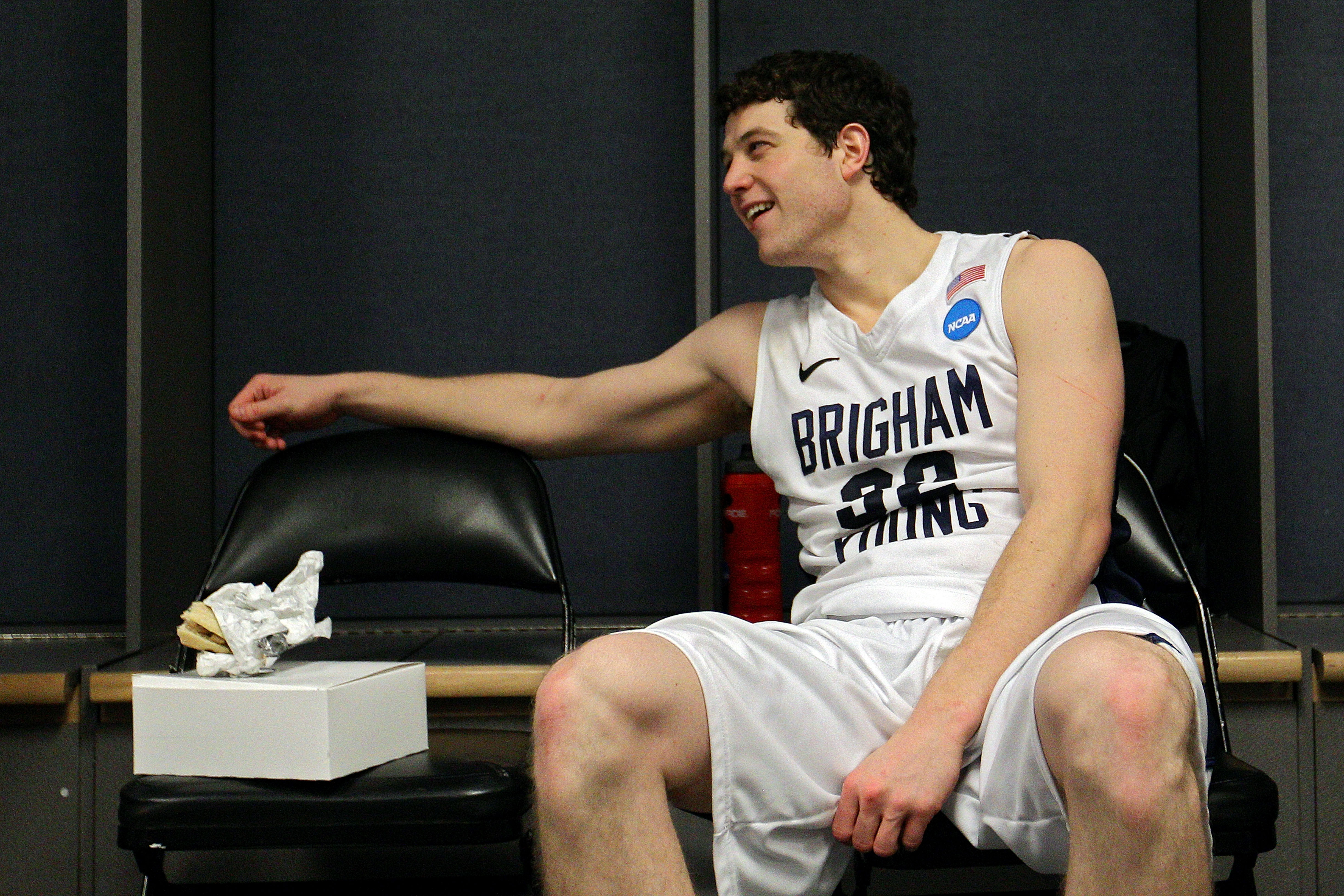 DENVER, CO - MARCH 19:  Jimmer Fredette #32 of the Brigham Young Cougars sits in the locker room after defeating the Gonzaga Bulldogs during the third round of the 2011 NCAA men's basketball tournament at Pepsi Center on March 19, 2011 in Denver, Colorado