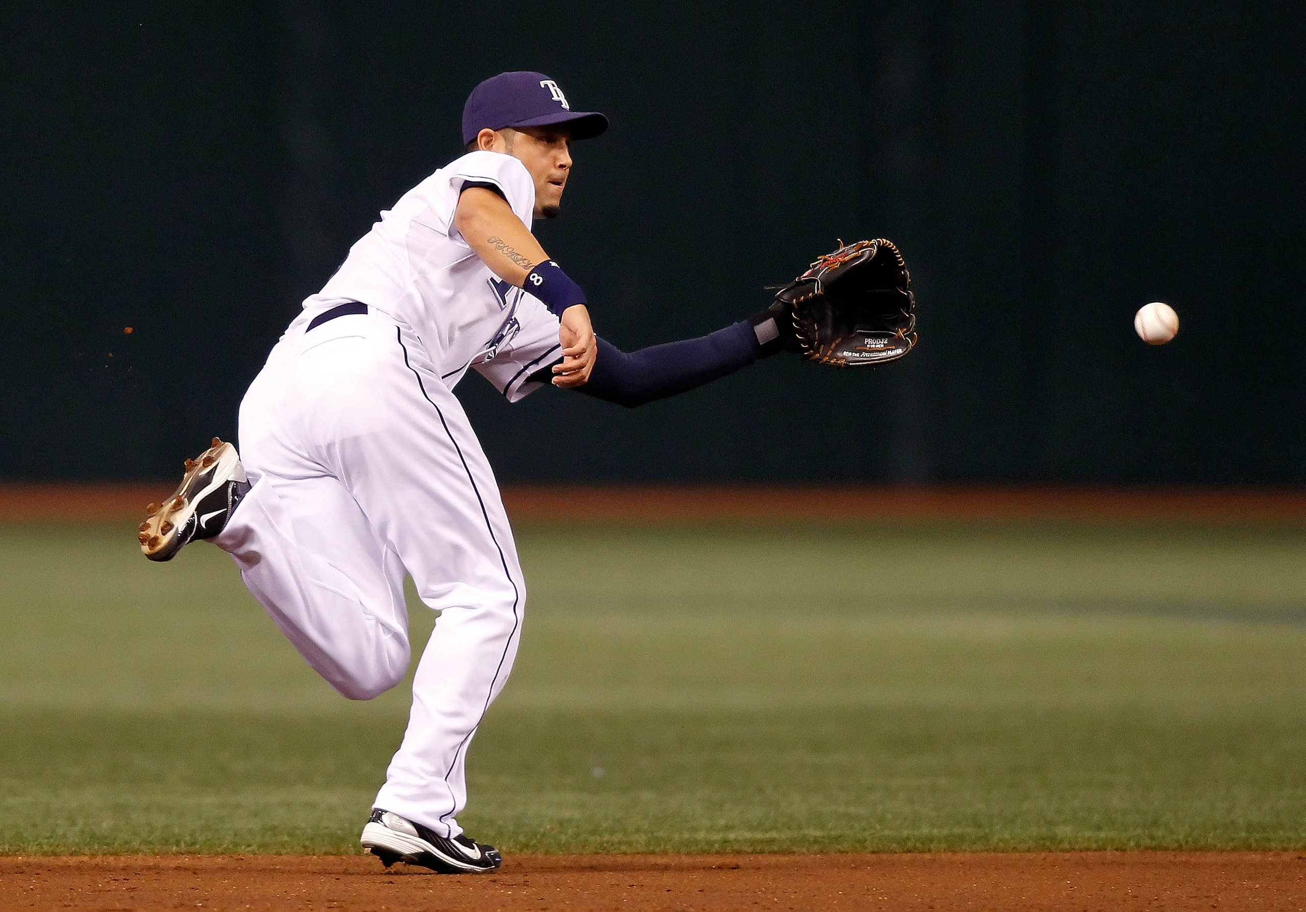 ST. PETERSBURG - AUGUST 17: Shortstop Jason Bartlett #8 of the Tampa Bay Rays fields a ground ball against the Texas Rangers during the game at Tropicana Field on August 17, 2010 in St. Petersburg, Florida. (Photo by J. Meric/Getty Images) ST. PETERSBURG - AUGUST 17: Shortstop Jason Bartlett #8 of the Tampa Bay Rays fields a ground ball against the Texas Rangers during the game at Tropicana Field on August 17, 2010 in St. Petersburg, Florida. (Photo by J. Meric/Getty Images)