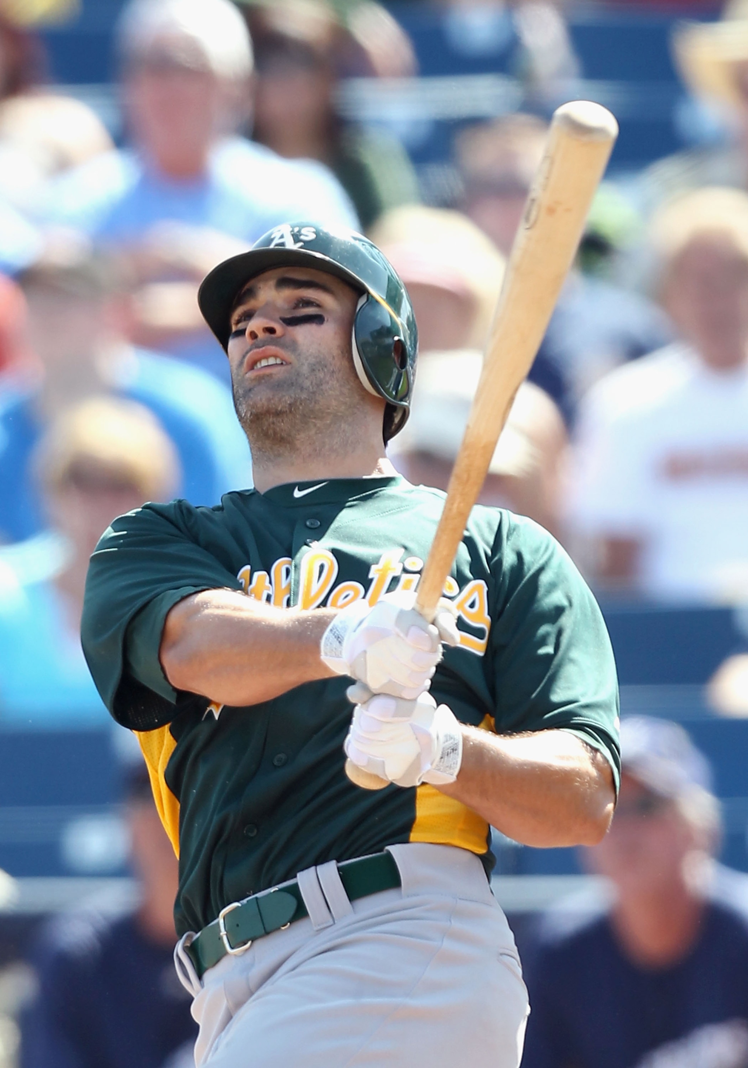 PHOENIX, AZ - MARCH 03:  Conor Jackson #28 of the Oakland Athletics bats against the Milwaukee Brewers during the spring training game at Maryvale Baseball Park on March 3, 2011 in Phoenix, Arizona.  (Photo by Christian Petersen/Getty Images)