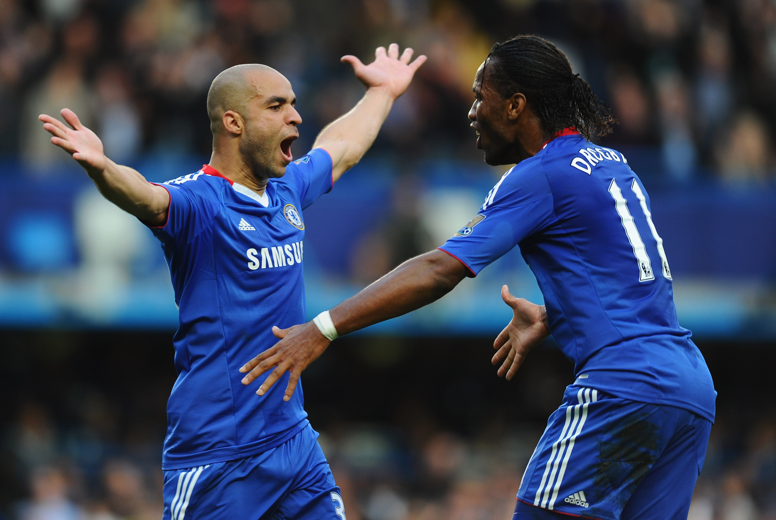 LONDON, ENGLAND - OCTOBER 03:  Alex of Chelsea celebrates with fellow goalscorer Didier Drogba after scoring during the Barclays Premier League match between Chelsea and Arsenal at Stamford Bridge on October 3, 2010 in London, England.  (Photo by Mike Hew