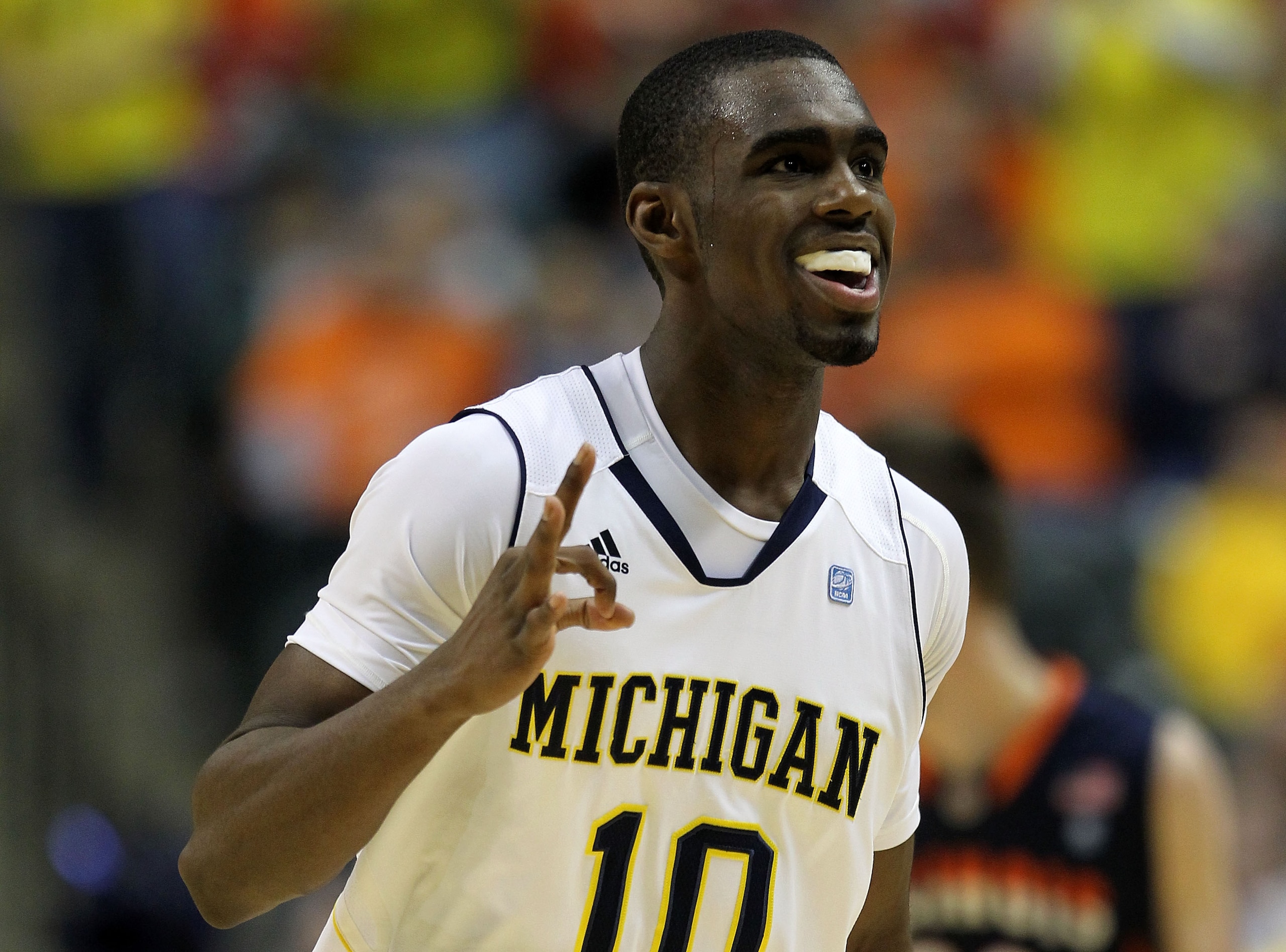 INDIANAPOLIS, IN - MARCH 11:  Tim Hardaway Jr. #10 of the Michigan Wolverines celebrates after he made a 3-point shot in the second half against the Illinois Fighting Illini during the quarterfinals of the 2011 Big Ten Men's Basketball Tournament at Conse