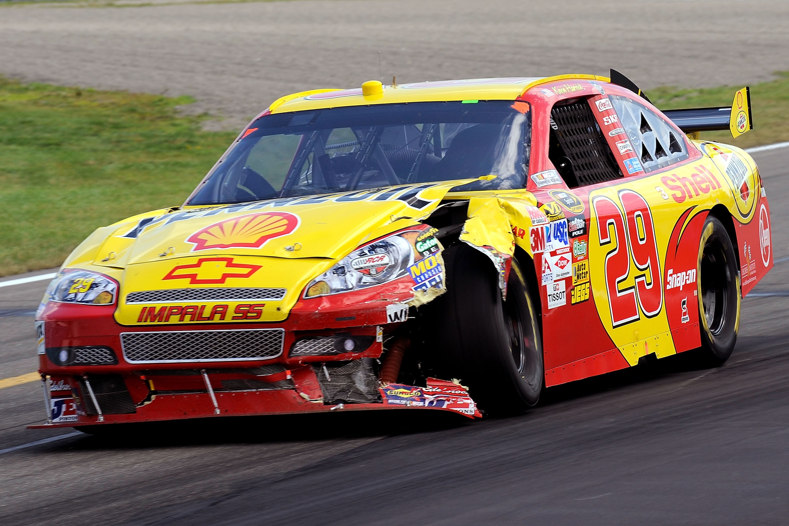 WATKINS GLEN, NY - AUGUST 10:  Kevin Harvick, driver of the #29 Shell/Pennzoil Chevrolet, races with damage after crashing with David Stremme, driver of the #12 Penske Dodge, during the NASCAR Sprint Cup Series Heluva Good! Sour Cream Dips at Watkins Glen