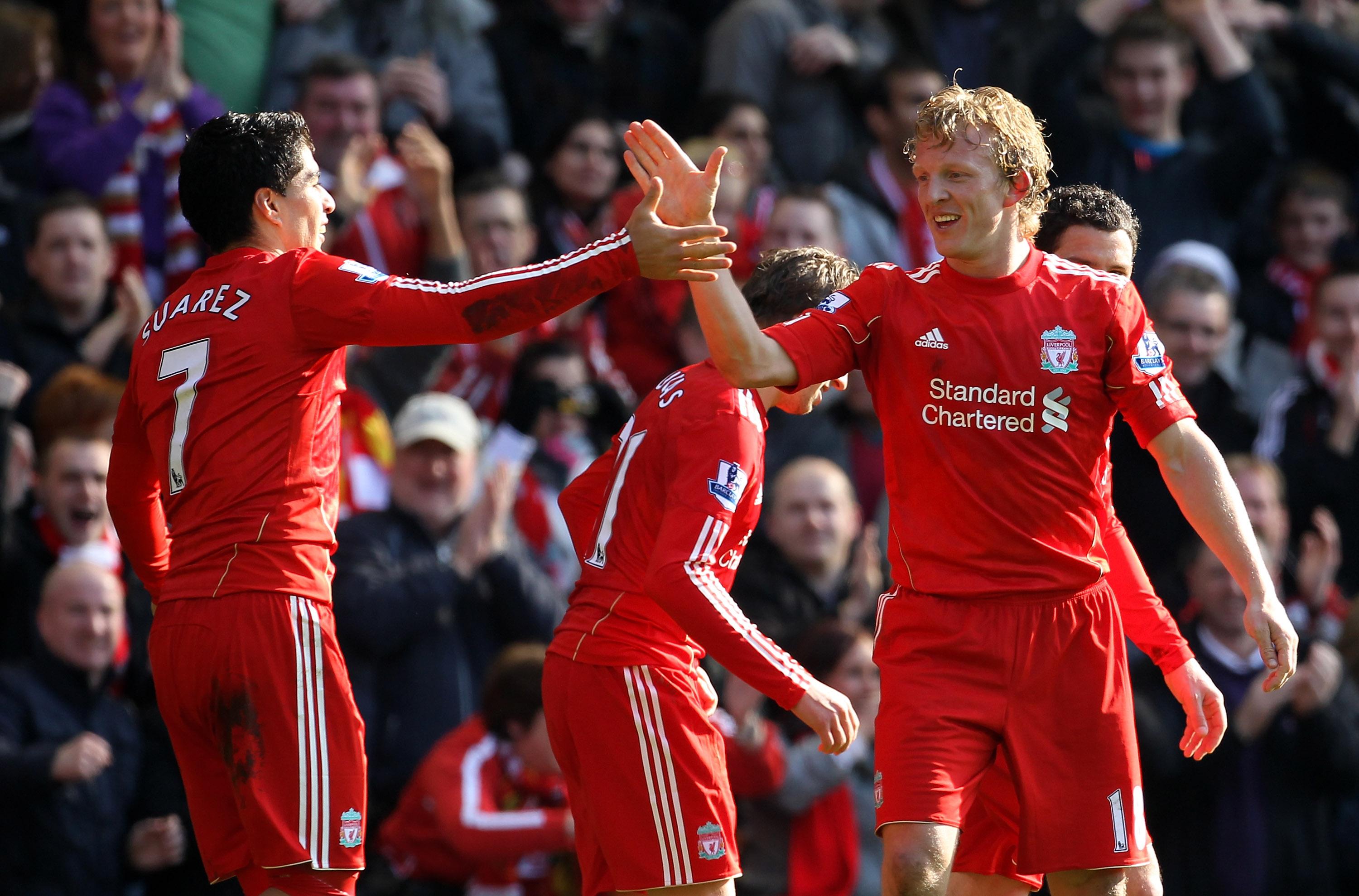 LIVERPOOL, ENGLAND - MARCH 06:  Dirk Kuyt of Liverpool celebrates scoring the opening goal with team mate Luis Suarez during the Barclays Premier League match between Liverpool and Manchester United at Anfield on March 6, 2011 in Liverpool, England.  (Pho