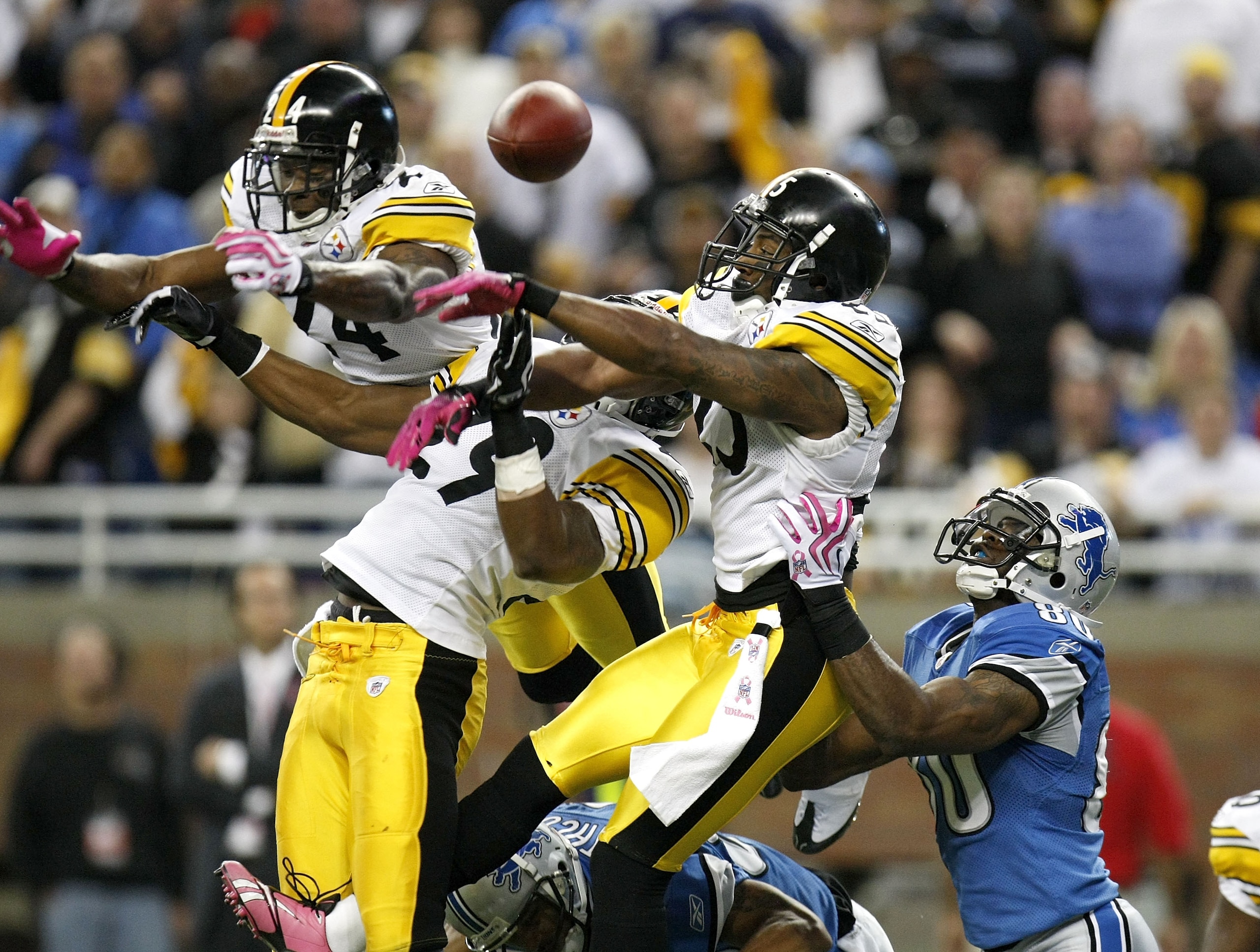 DETROIT , MI - OCTOBER 11: Ryan Clark #25, Ryan Mundy #29 and Ike Taylor #24 of the Pittsburgh Steelers break up a pass in the end zone intended for Bryant Johnson #80 of the Detroit Lions on October 11, 2009 at Ford Field in Detroit, Michigan. Pittsburgh