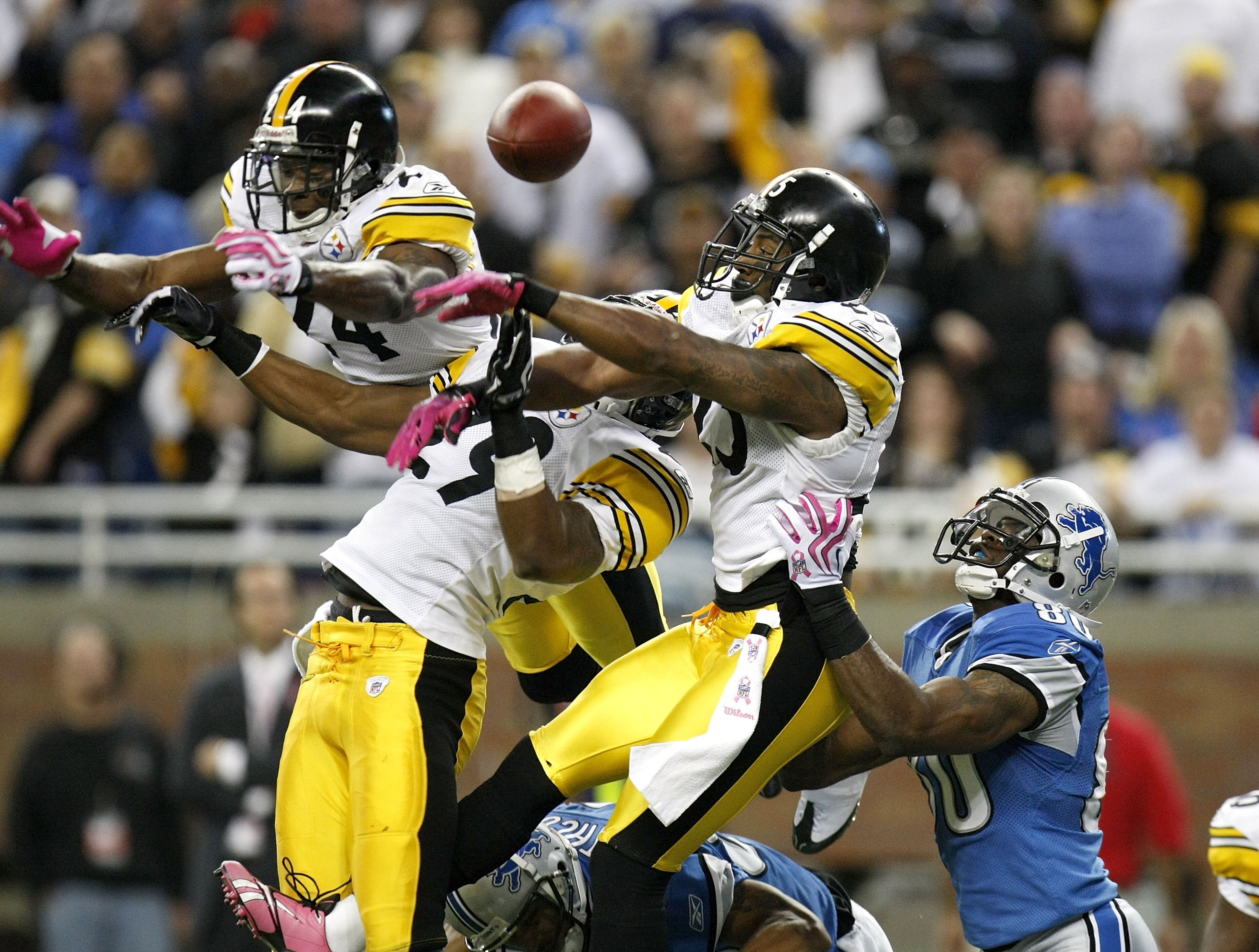 DETROIT , MI - OCTOBER 11: Ryan Clark #25, Ryan Mundy #29 and Ike Taylor #24 of the Pittsburgh Steelers break up a pass in the end zone intended for Bryant Johnson #80 of the Detroit Lions on October 11, 2009 at Ford Field in Detroit, Michigan. Pittsburgh
