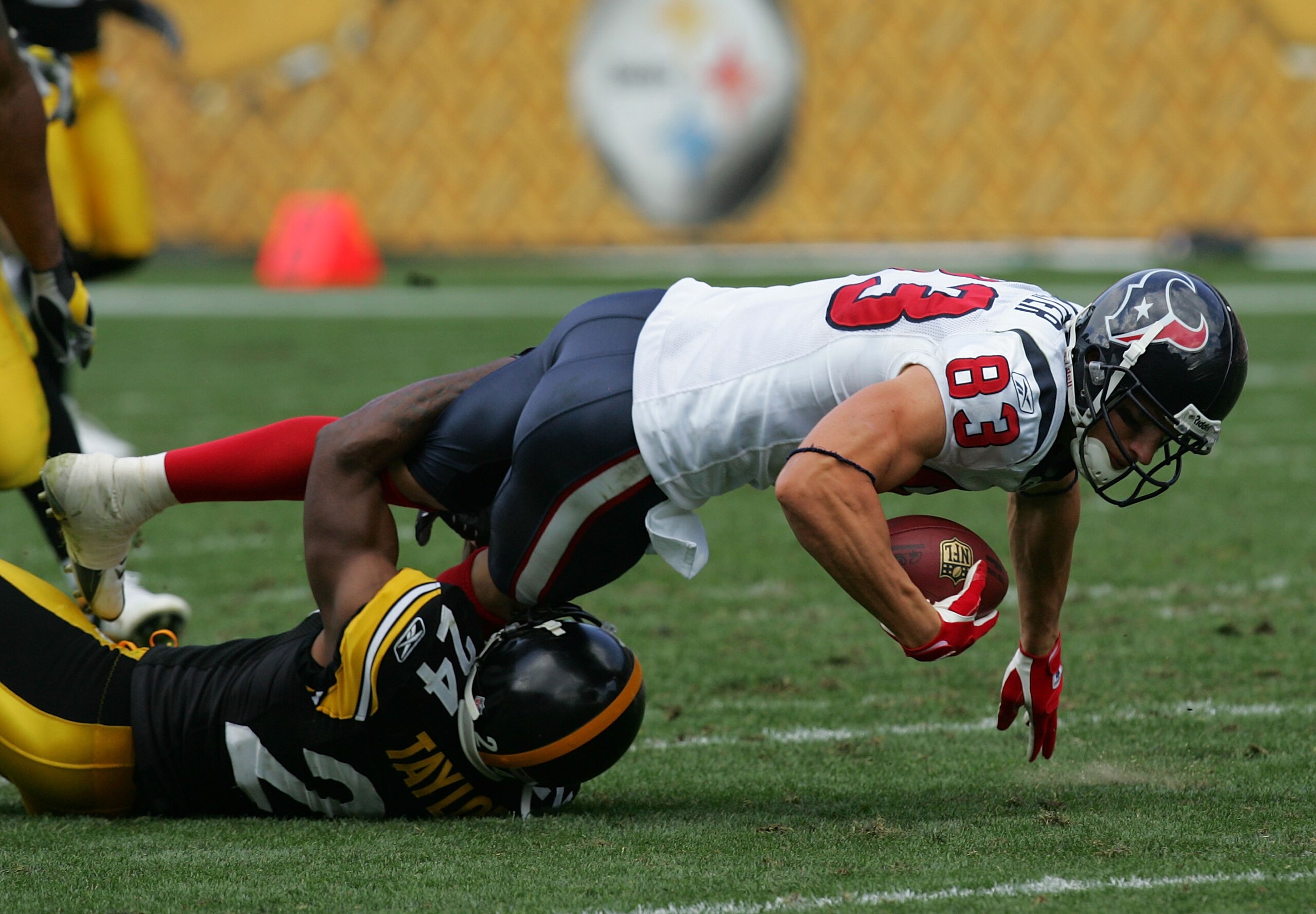 PITTSBURGH - SEPTEMBER 07:  Wide receiver Kevin Walter #83 of the Houston Texans is tackled by Ike Taylor #24 of the Pittsburgh Steelers on September 7, 2008 at Heinz Field in Pittsburgh, Pennsylvania.  (Photo by Ronald Martinez/Getty Images)