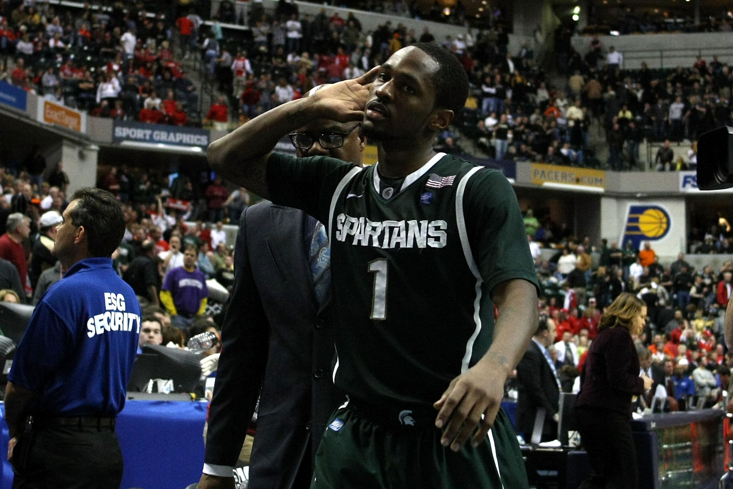 INDIANAPOLIS, IN - MARCH 11:  Kalin Lucas #1 of the Michigan State Spartans calls on the fans as he wals off the court after Michigan State won 74-56 against the Purdue Boilermakers during the quarterfinals of the 2011 Big Ten Men's Basketball Tournament