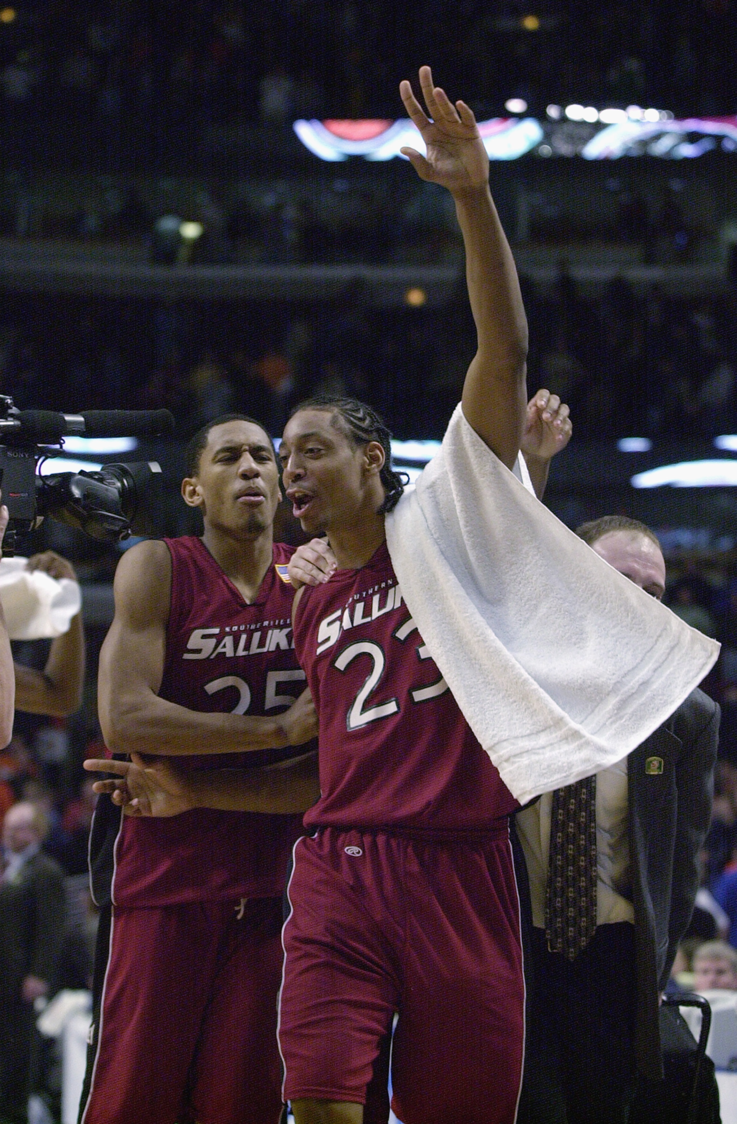 CHICAGO - MARCH 17: Jermaine Dearman #23 and Daniel Szymanek #25 of the Southern Illinois Salukis celebrate their upset over the Georgia Bulldogs during the second round of the 2002 NCAA Division I Men's Basketball Tournament on March 17, 2002 at United CHICAGO - MARCH 17: Jermaine Dearman #23 and Daniel Szymanek #25 of the Southern Illinois Salukis celebrate their upset over the Georgia Bulldogs during the second round of the 2002 NCAA Division I Men's Basketball Tournament on March 17, 2002 at United