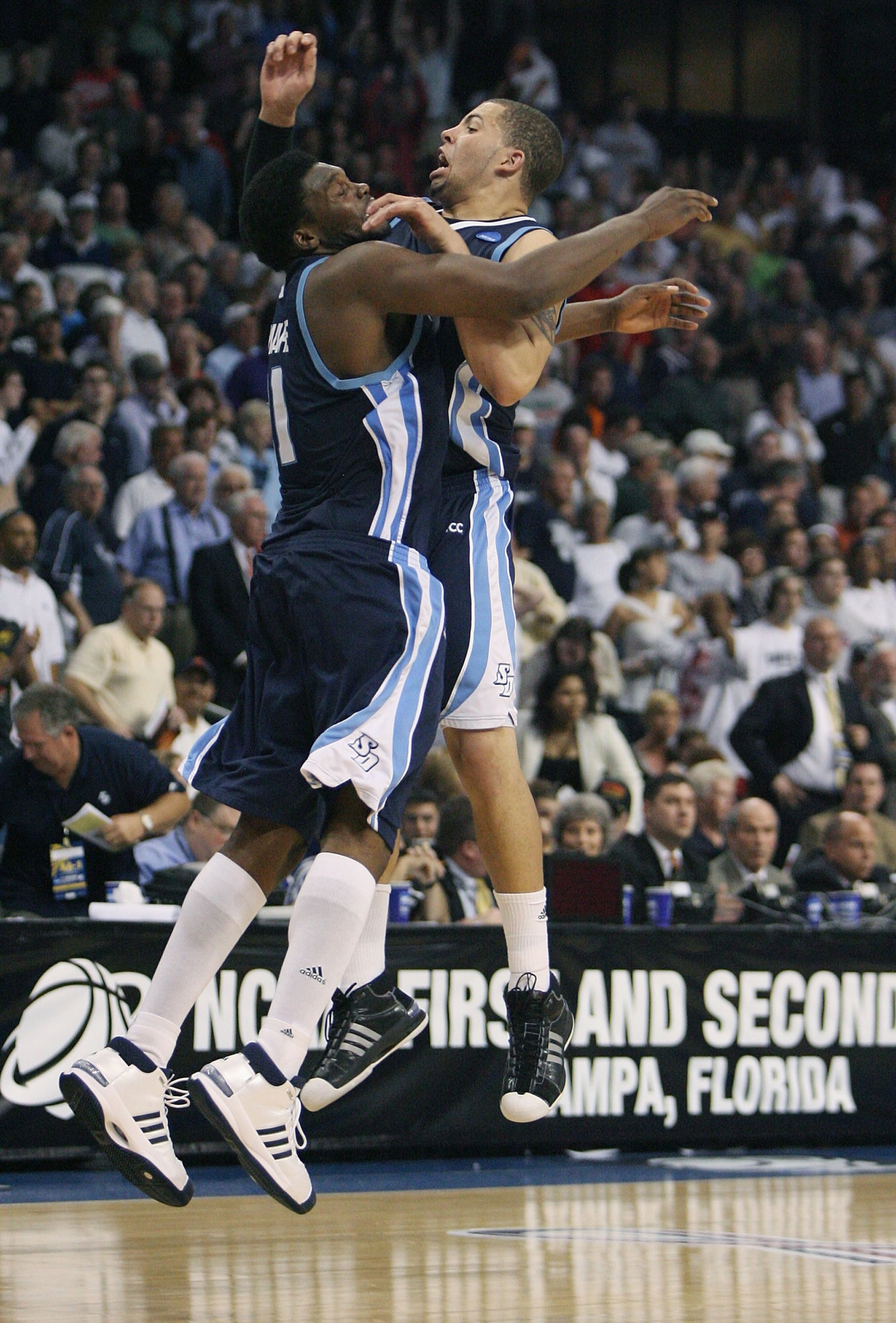 TAMPA, FL - MARCH 21: Gyno Pomare #21 and Rob Jones #22 of the San Diego Toreros celebrate their team's 70-69 overtime win over the Connecticut Huskies in the first round of the 2008 NCAA Tournament West Regional at the St. Pete Times Forum on March 21, TAMPA, FL - MARCH 21: Gyno Pomare #21 and Rob Jones #22 of the San Diego Toreros celebrate their team's 70-69 overtime win over the Connecticut Huskies in the first round of the 2008 NCAA Tournament West Regional at the St. Pete Times Forum on March 21,