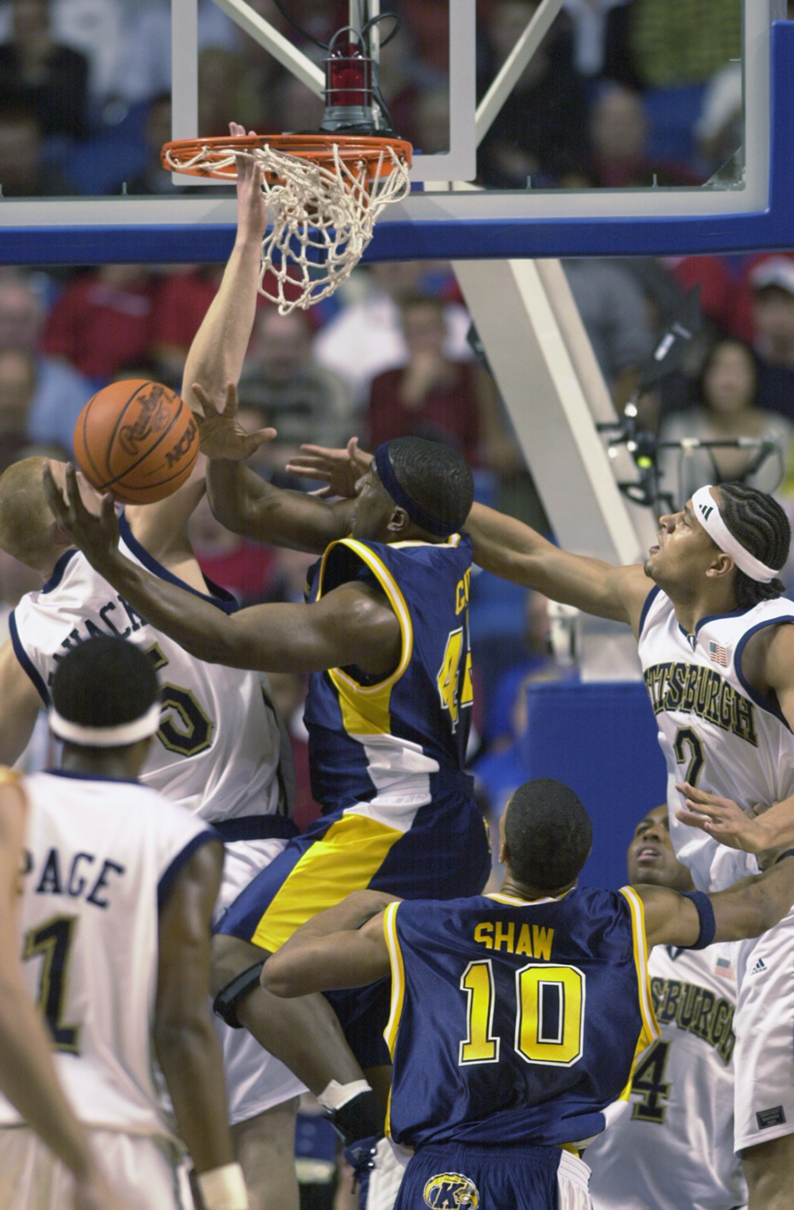 LEXINGTON, KY - MARCH 21: Antonio Gates #44 of the Kent State Golden Flashes puts up a shot under pressure from Donatas Zavackas #5 and Chevon Troutman #2 of the Pittsburgh Panthers during the Midwest Regional Semifinal during the 2002 NCAA Men's Basketb LEXINGTON, KY - MARCH 21: Antonio Gates #44 of the Kent State Golden Flashes puts up a shot under pressure from Donatas Zavackas #5 and Chevon Troutman #2 of the Pittsburgh Panthers during the Midwest Regional Semifinal during the 2002 NCAA Men's Basketb