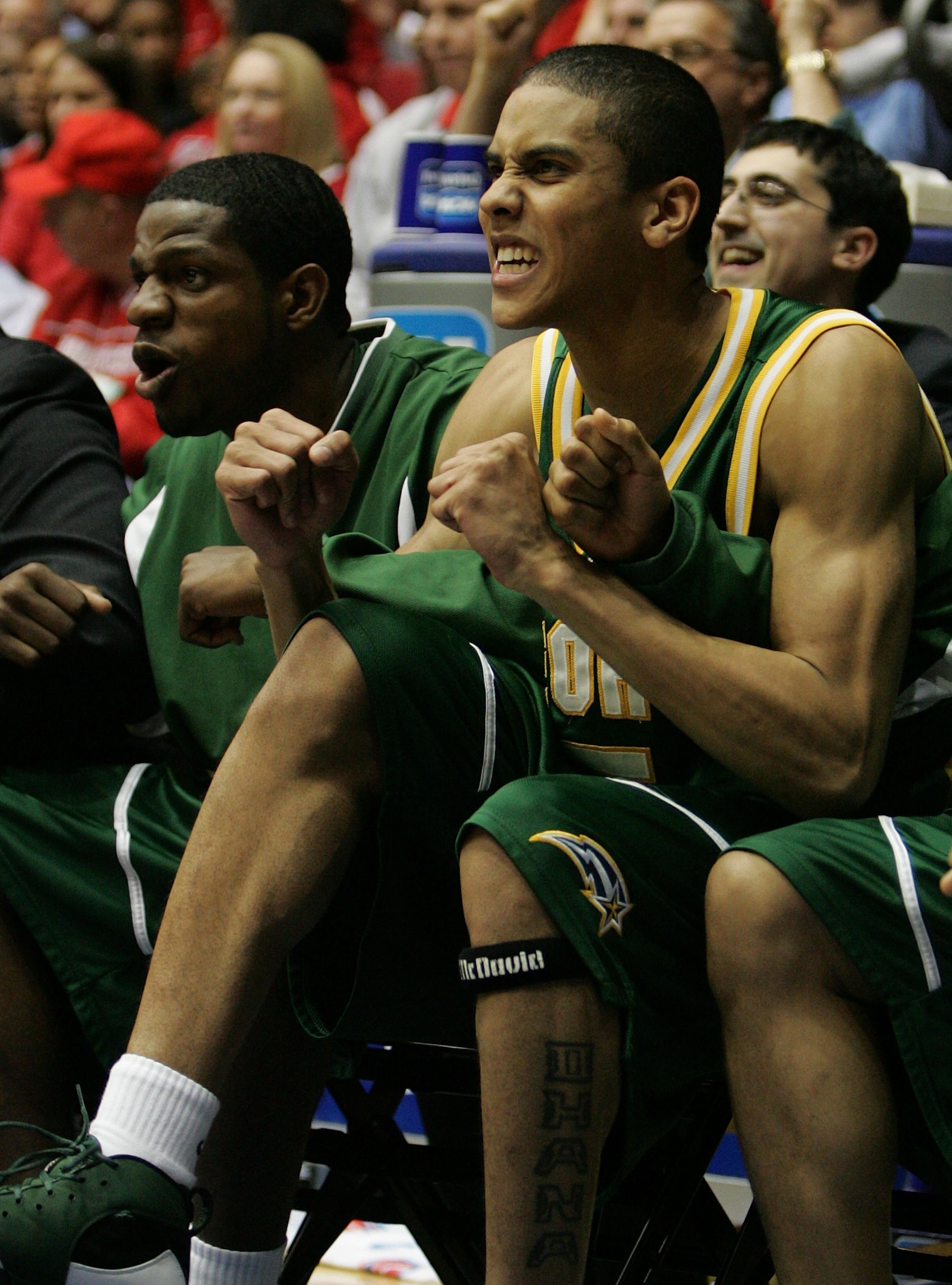 DAYTON, OH - MARCH 19: Gabe Norwood # 5 (R) of the George Mason Patriots celebrates during the game against the North Carolina Tar Heels in the Second Round of the 2006 NCAA Men's Basketball Tournament at the University of Dayton Arena March 19, 2006 in DAYTON, OH - MARCH 19: Gabe Norwood # 5 (R) of the George Mason Patriots celebrates during the game against the North Carolina Tar Heels in the Second Round of the 2006 NCAA Men's Basketball Tournament at the University of Dayton Arena March 19, 2006 in