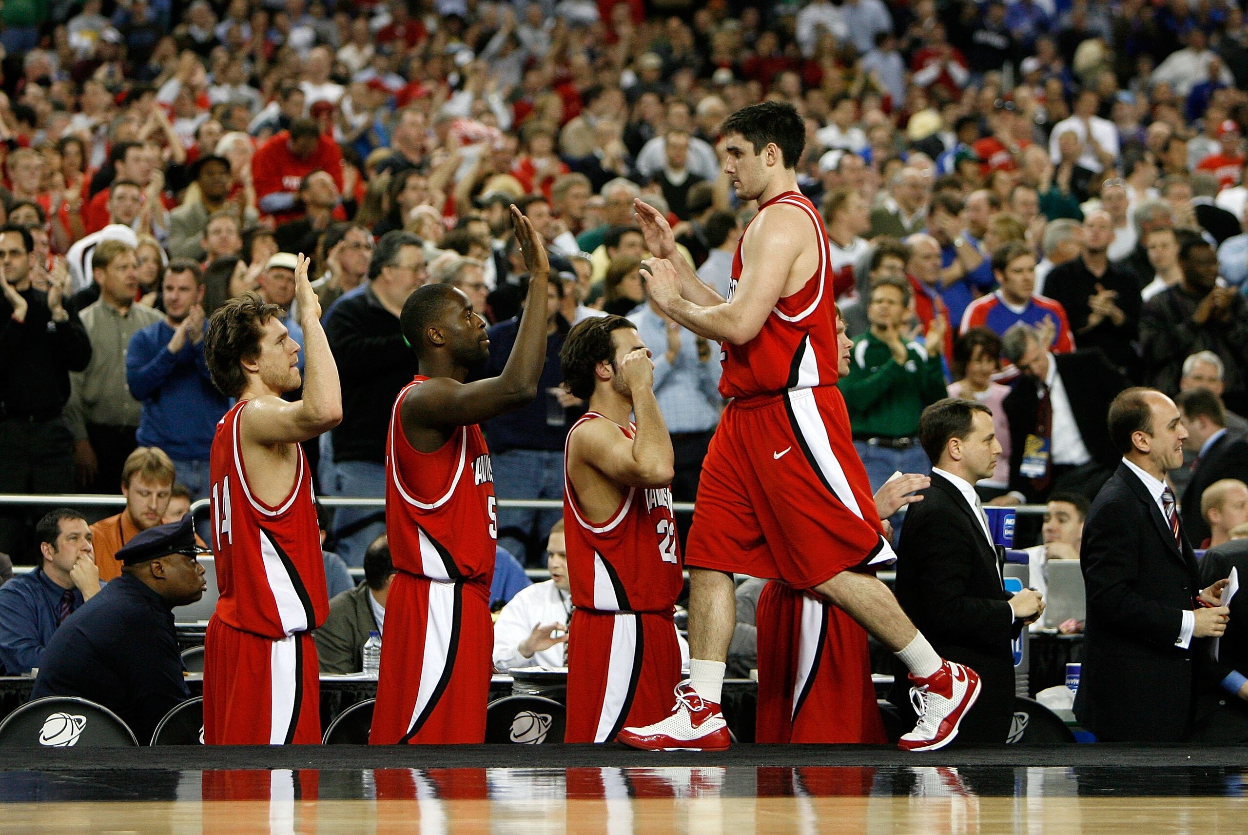 DETROIT - MARCH 28: Jason Richards #2 of the Davidson Wildcats greets his teammates as he checks out of the game late in the second half against the Wisconsin Badgers during the Midwest Regional Semifinal of the 2008 NCAA Division I Men's Basketball Tour DETROIT - MARCH 28: Jason Richards #2 of the Davidson Wildcats greets his teammates as he checks out of the game late in the second half against the Wisconsin Badgers during the Midwest Regional Semifinal of the 2008 NCAA Division I Men's Basketball Tour