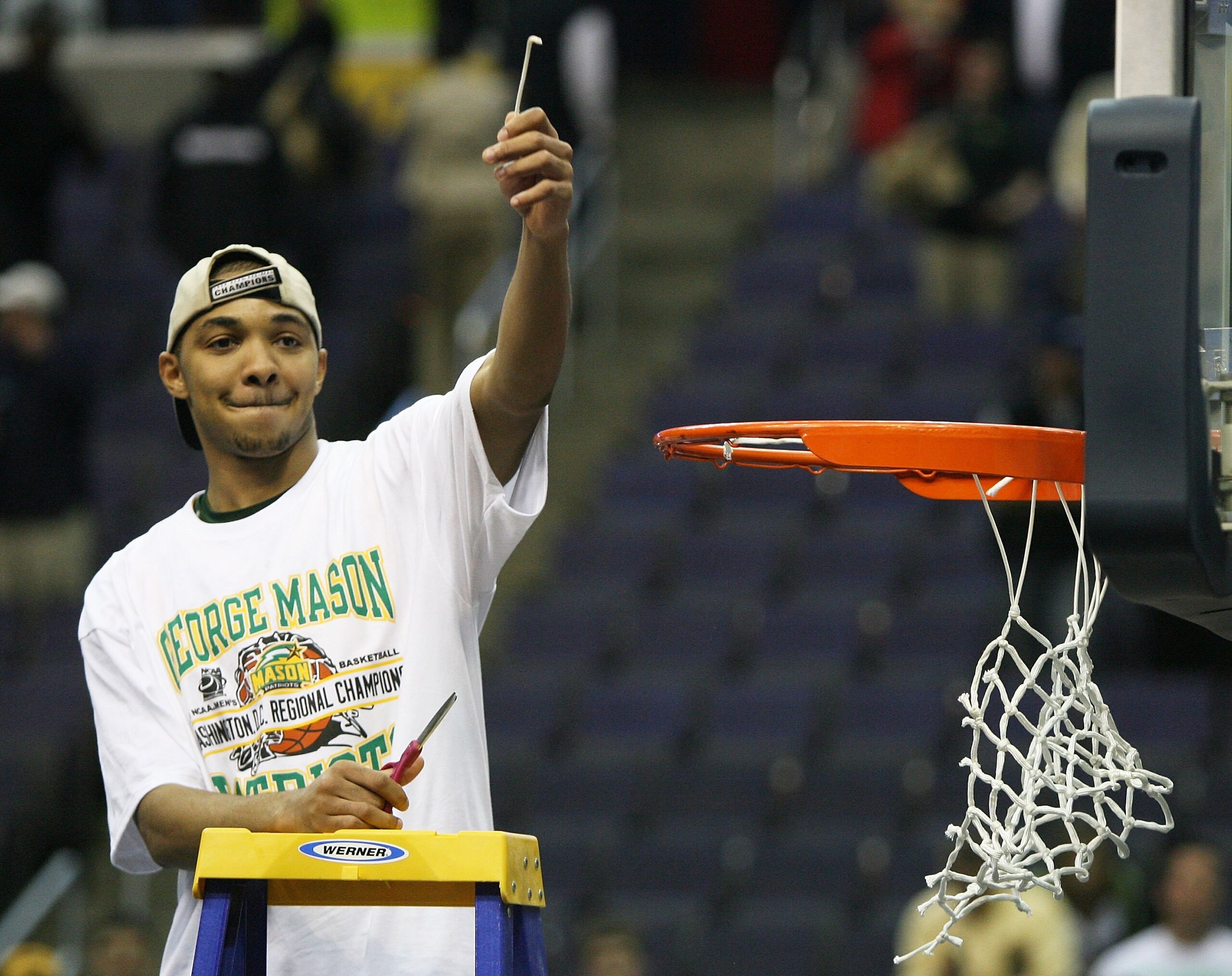 WASHINGTON - MARCH 26: Lamar Butler #22 of the George Mason Patriots cuts down the net after defeating the Connecticut Huskies in overtime during the Regional Finals of the NCAA Men's Basketball Tournament on March 26, 2006 at the Verizon Center in Washi WASHINGTON - MARCH 26: Lamar Butler #22 of the George Mason Patriots cuts down the net after defeating the Connecticut Huskies in overtime during the Regional Finals of the NCAA Men's Basketball Tournament on March 26, 2006 at the Verizon Center in Washi