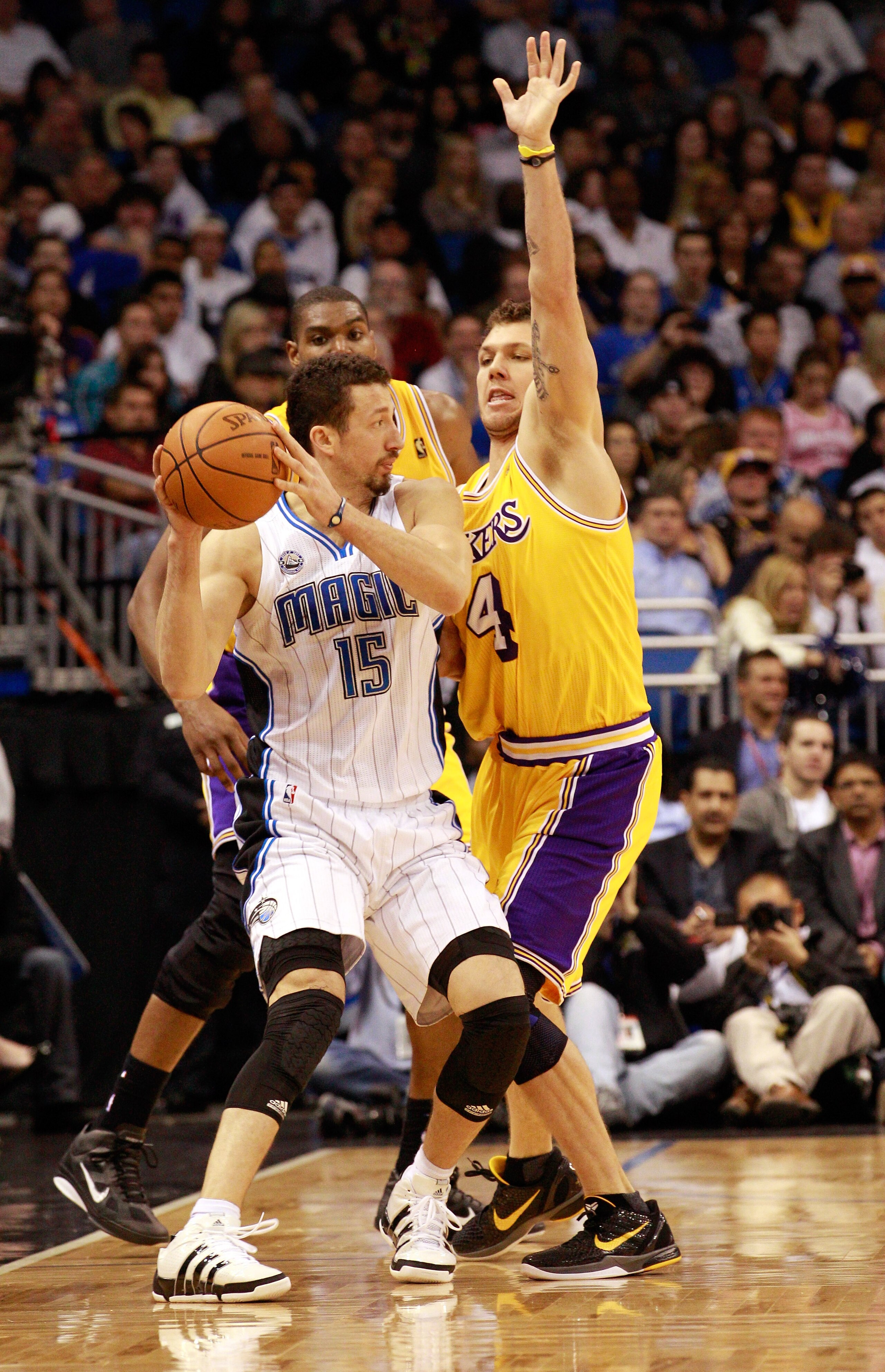 ORLANDO, FL - FEBRUARY 13:  Hedo Turkoglu #15 of the Orlando Magic is guarded by Luke Walton #4 of the Los Angeles Lakers during the game at Amway Arena on February 13, 2011 in Orlando, Florida.  NOTE TO USER: User expressly acknowledges and agrees that,