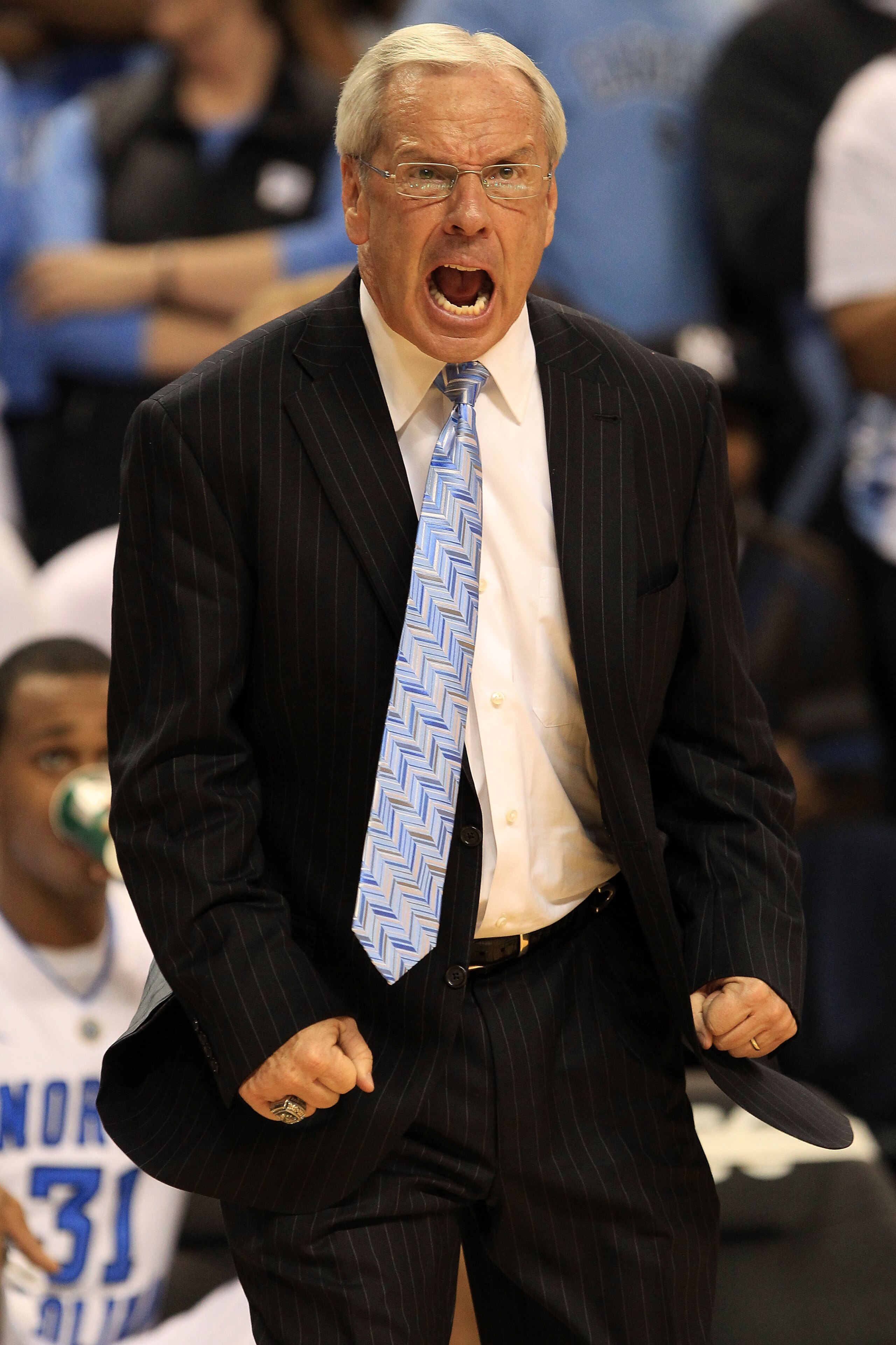 GREENSBORO, NC - MARCH 12:  Head coach Roy Williams of the North Carolina Tar Heels reacts during overtime against the Clemson Tigers in the semifinals of the 2011 ACC men's basketball tournament at the Greensboro Coliseum on March 12, 2011 in Greensboro,