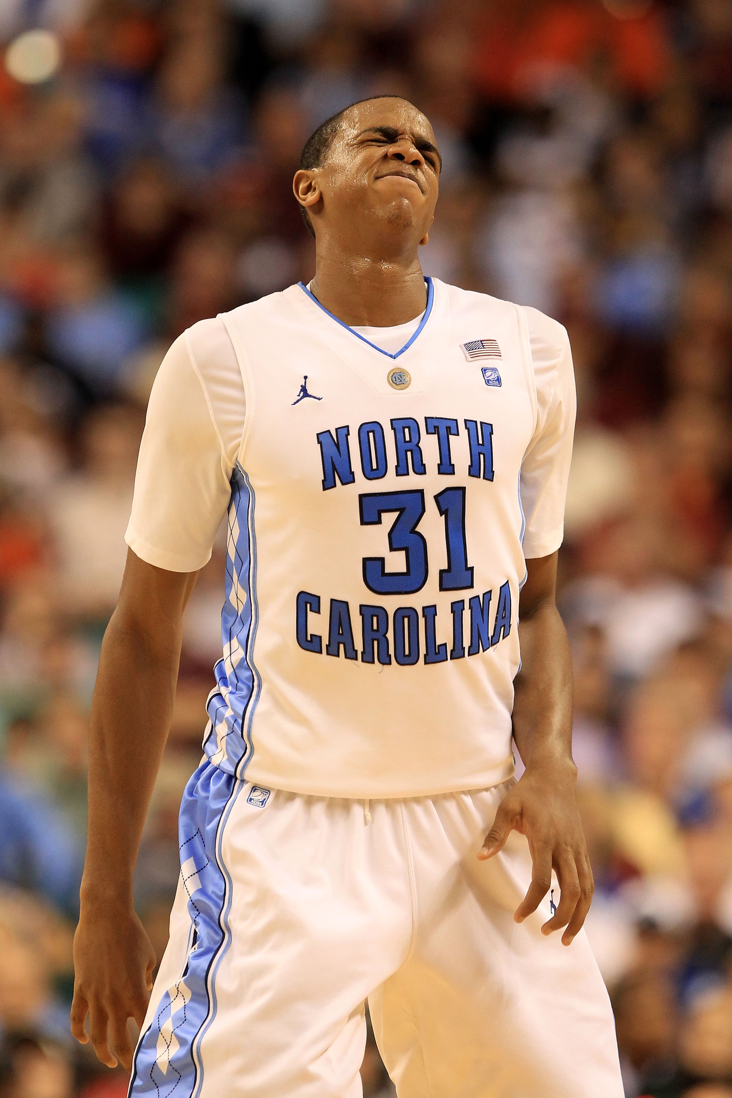 GREENSBORO, NC - MARCH 12:  John Henson #31 of the North Carolina Tar Heels reacts during the second half against the Clemson Tigers in the semifinals of the 2011 ACC men's basketball tournament at the Greensboro Coliseum on March 12, 2011 in Greensboro,