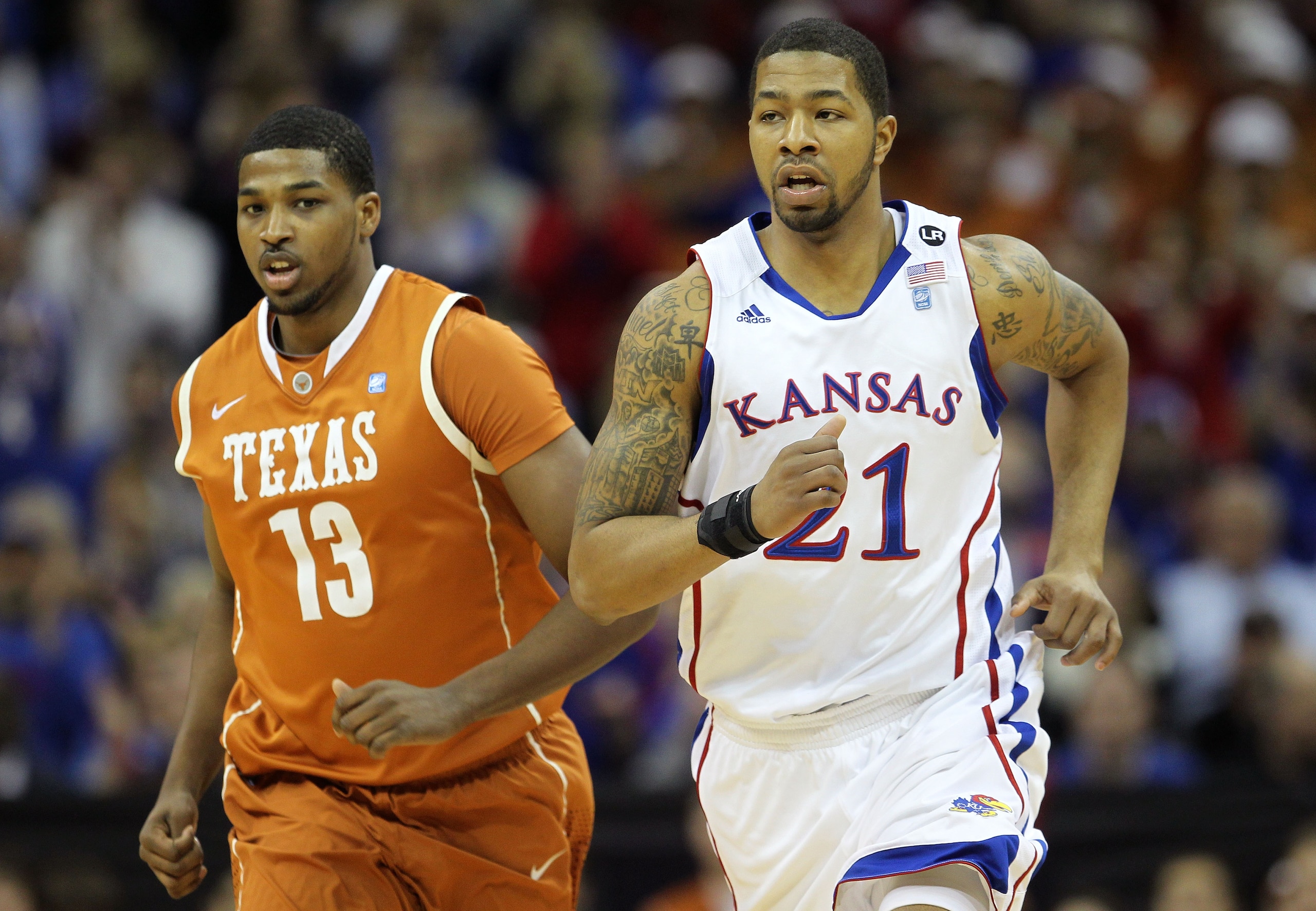 KANSAS CITY, MO - MARCH 12:  Markieff Morris #21 of the Kansas Jayhawks and Tristan Thompson #13 of the Texas Longhorns jog on the court during the 2011 Phillips 66 Big 12 Men's Basketball Tournament championship game at Sprint Center on March 12, 2011 in