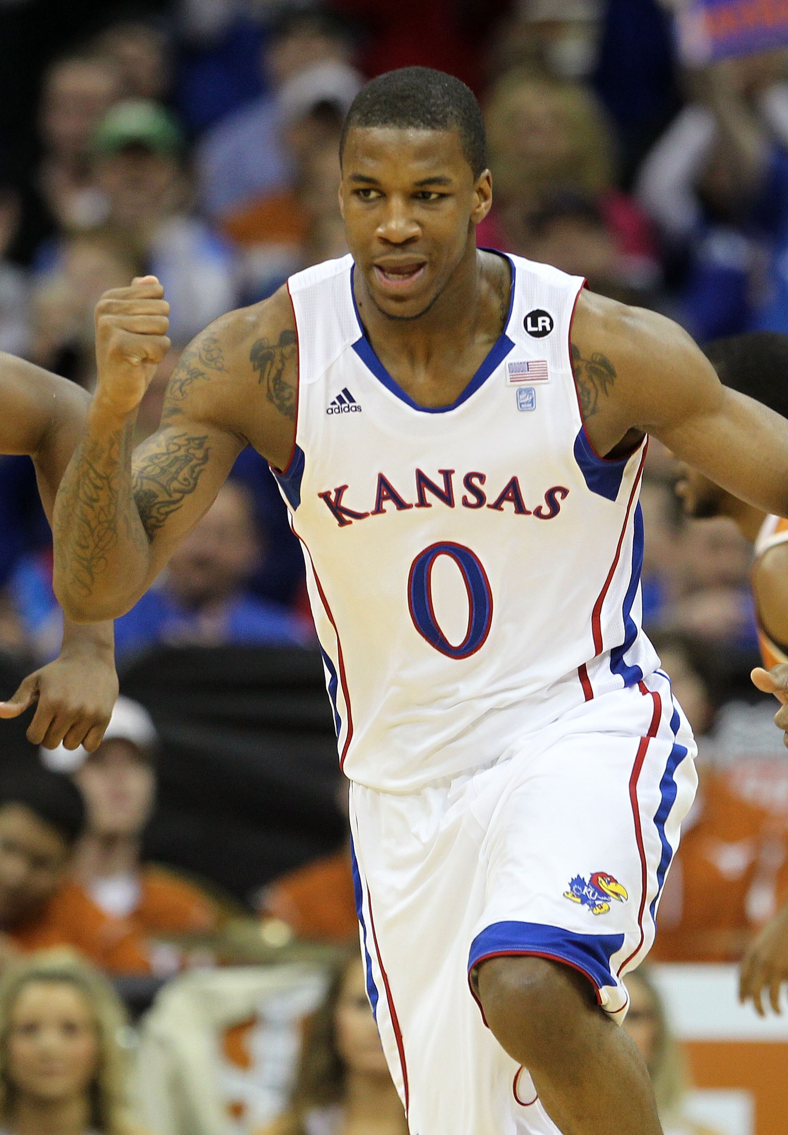 KANSAS CITY, MO - MARCH 12:  Thomas Robinson #0 of the Kansas Jayhawks reacts to a play against the Texas Longhorns in the first half of the 2011 Phillips 66 Big 12 Men's Basketball Tournament championship game at Sprint Center on March 12, 2011 in Kansas