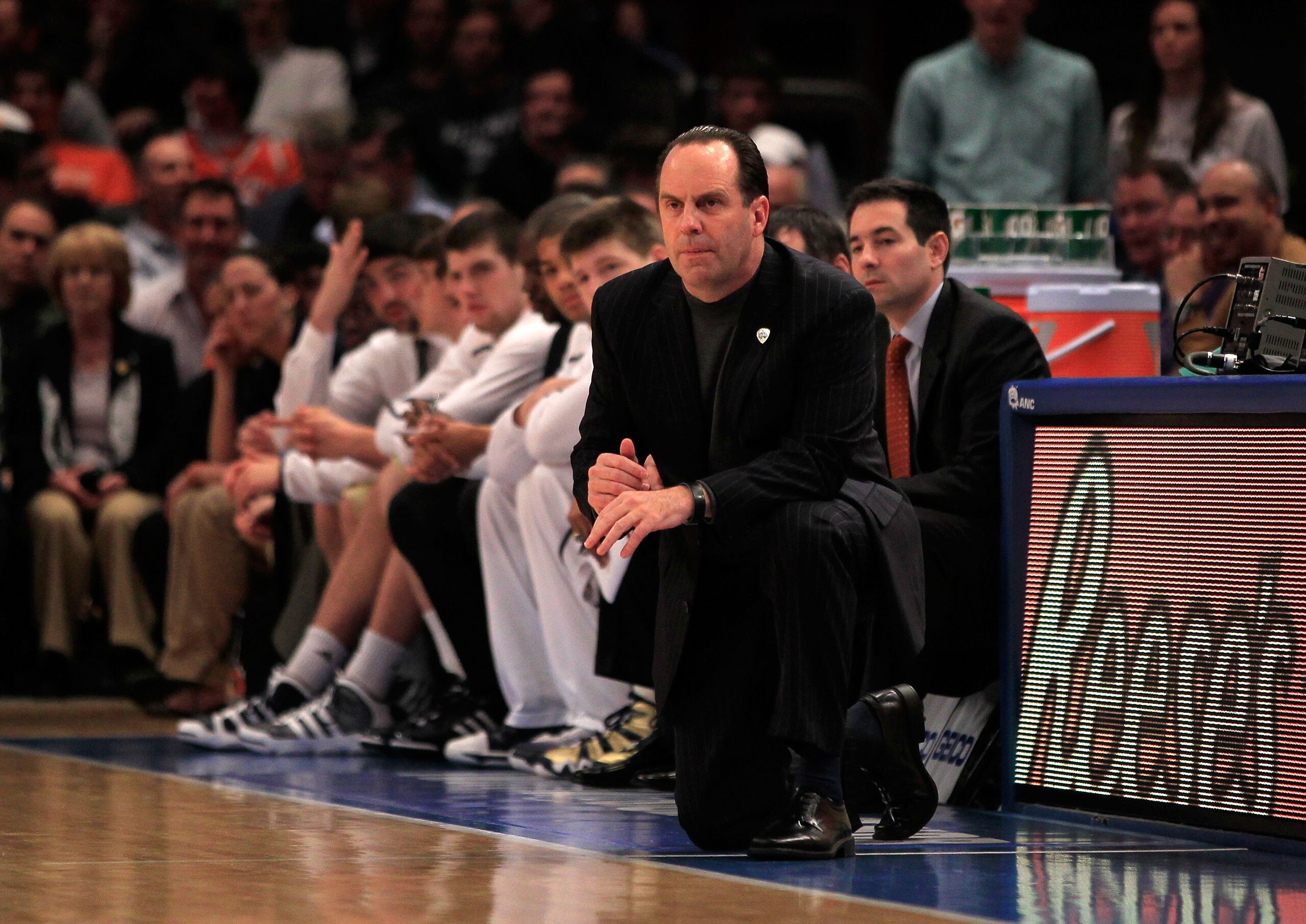NEW YORK, NY - MARCH 11: Head coach Mike Brey of the Notre Dame Fighting Irish looks on from the bench during the game against the Louisville Cardinals during the semifinals of the 2011 Big East Men's Basketball Tournament presented by American Eagle Outf