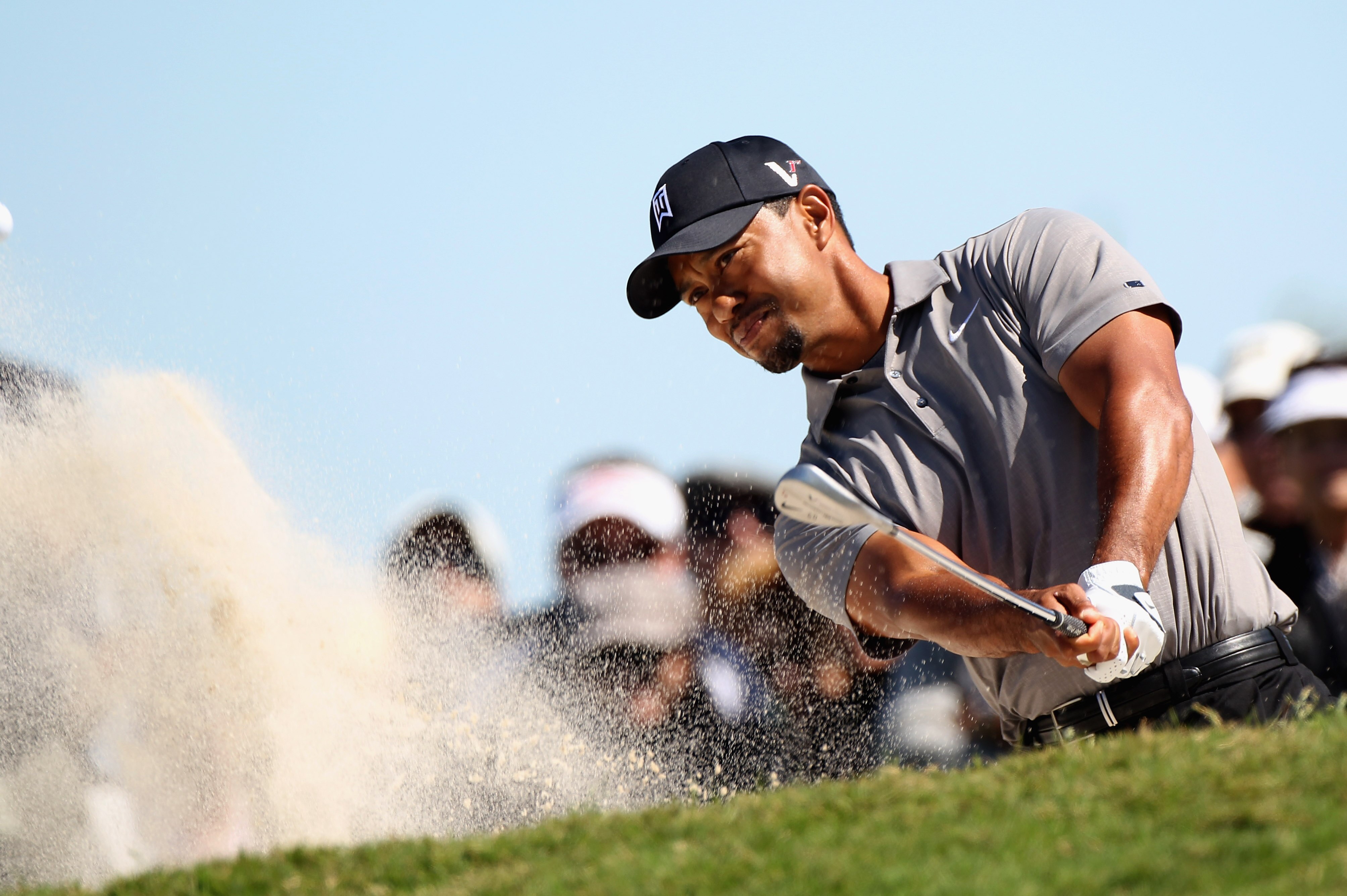 MIAMI, FL - MARCH 11:  Tiger Woods plays a bunker shot on the fourth hole during the second round of the 2011 WGC- Cadillac Championship at the TPC Blue Monster at the Doral Golf Resort and Spa on March 11, 2011 in Doral, Florida.  (Photo by Sam Greenwood