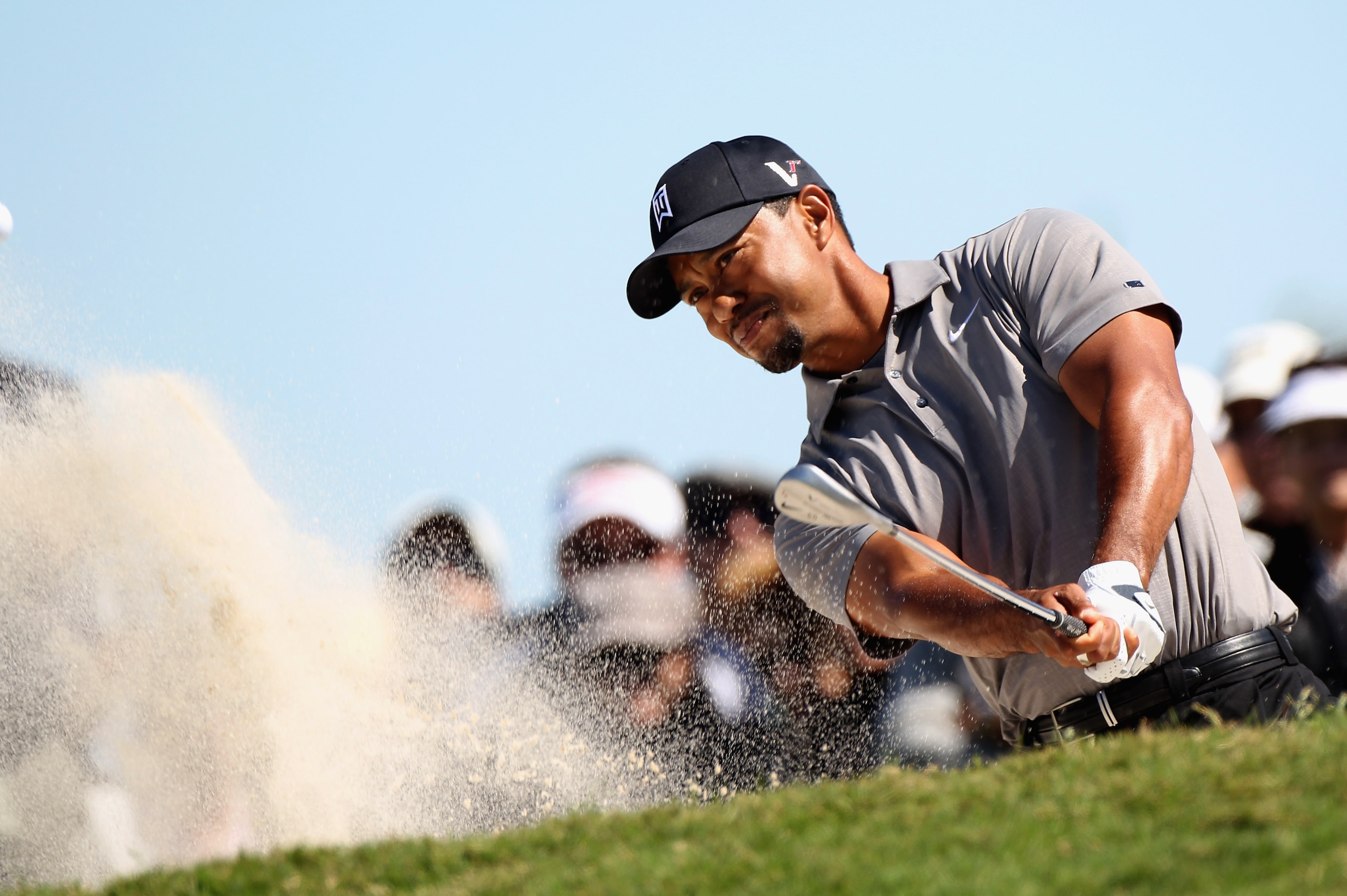 MIAMI, FL - MARCH 11:  Tiger Woods plays a bunker shot on the fourth hole during the second round of the 2011 WGC- Cadillac Championship at the TPC Blue Monster at the Doral Golf Resort and Spa on March 11, 2011 in Doral, Florida.  (Photo by Sam Greenwood