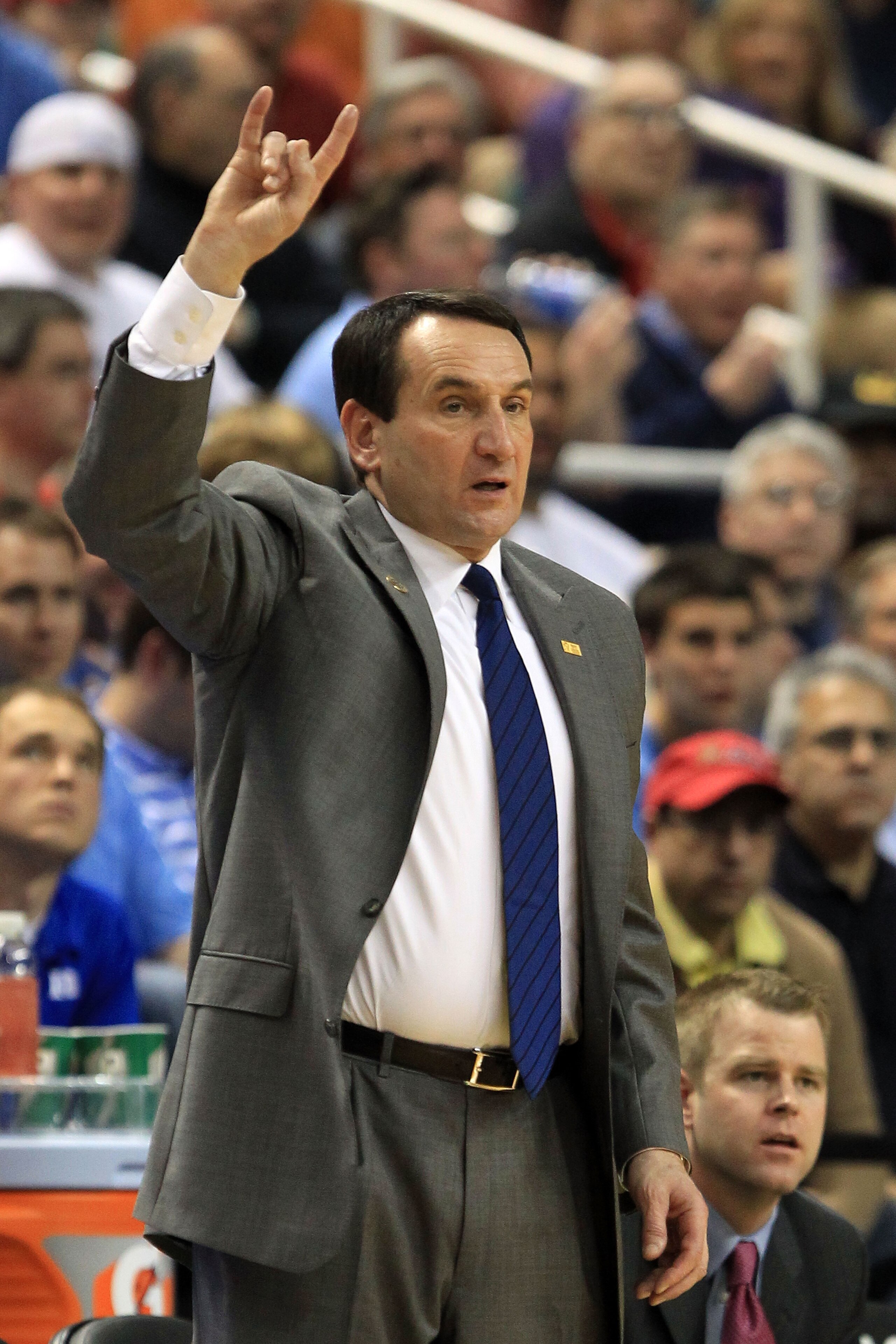 GREENSBORO, NC - MARCH 12:  Head coach Mike Krzyzewski of the Duke Blue Devils signals during the first half against the Virginia Tech Hokies in the semifinals of the 2011 ACC men's basketball tournament at the Greensboro Coliseum on March 12, 2011 in Gre