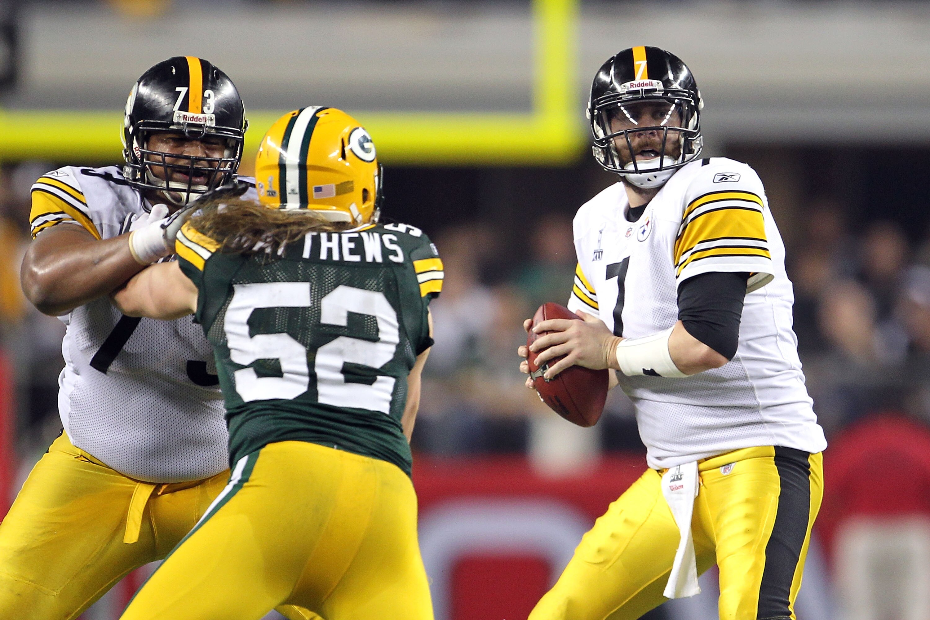 ARLINGTON, TX - FEBRUARY 06:  Quarterback Ben Roethlisberger #7 of the Pittsburgh Steelers looks to pass under pressure from Clay Matthews #52 of the Green Bay Packers during Super Bowl XLV at Cowboys Stadium on February 6, 2011 in Arlington, Texas.  (Pho