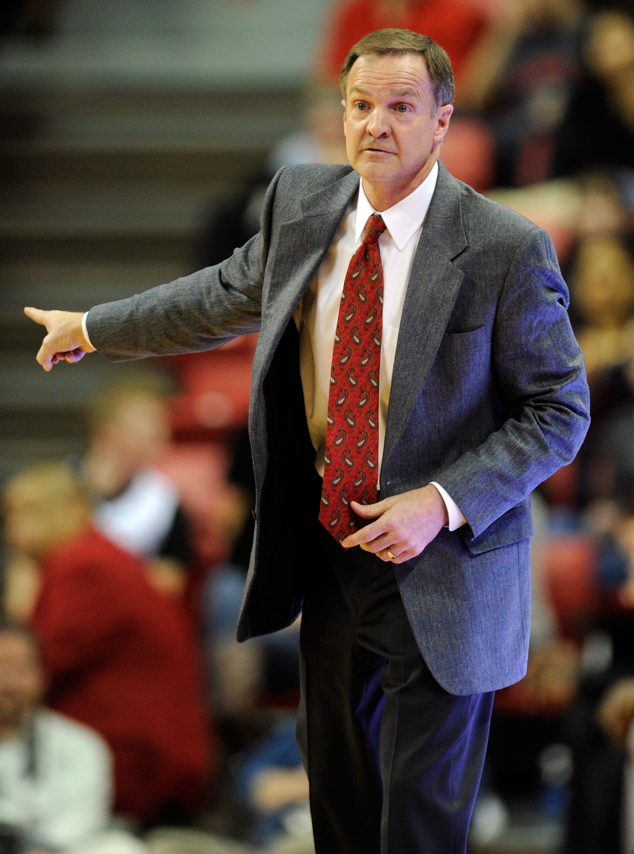 LAS VEGAS, NV - FEBRUARY 15:  Head coach Lon Kruger of the UNLV Rebels gestures during a game against the Air Force Falcons at the Thomas & Mack Center February 15, 2011 in Las Vegas, Nevada. UNLV won 49-42.  (Photo by Ethan Miller/Getty Images)