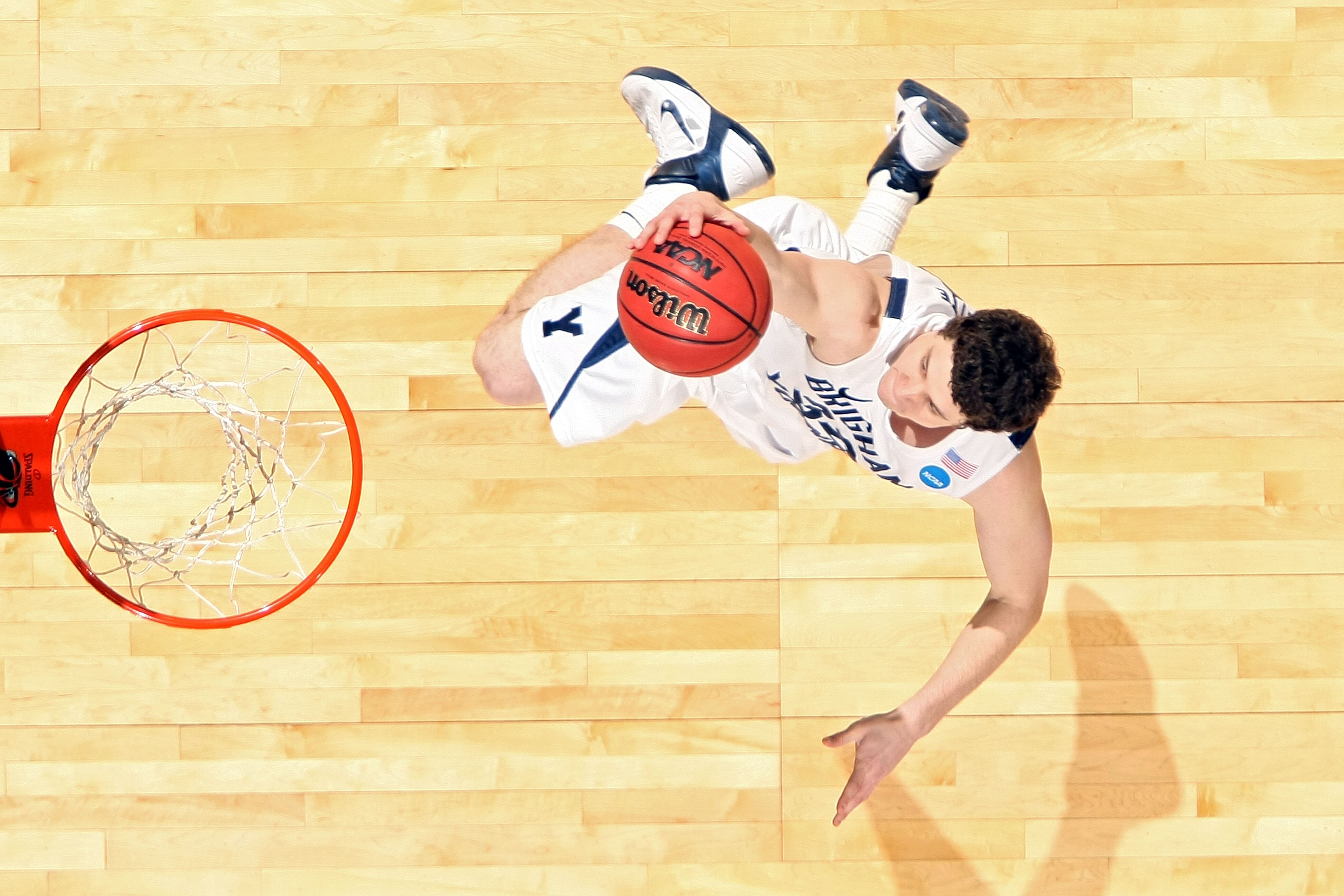 DENVER, CO - MARCH 17:  Jimmer Fredette #32 of the Brigham Young Cougars goes to the hoop for a layup against the Wofford Terriers during the second round of the 2011 NCAA men's basketball tournament at Pepsi Center on March 17, 2011 in Denver, Colorado.