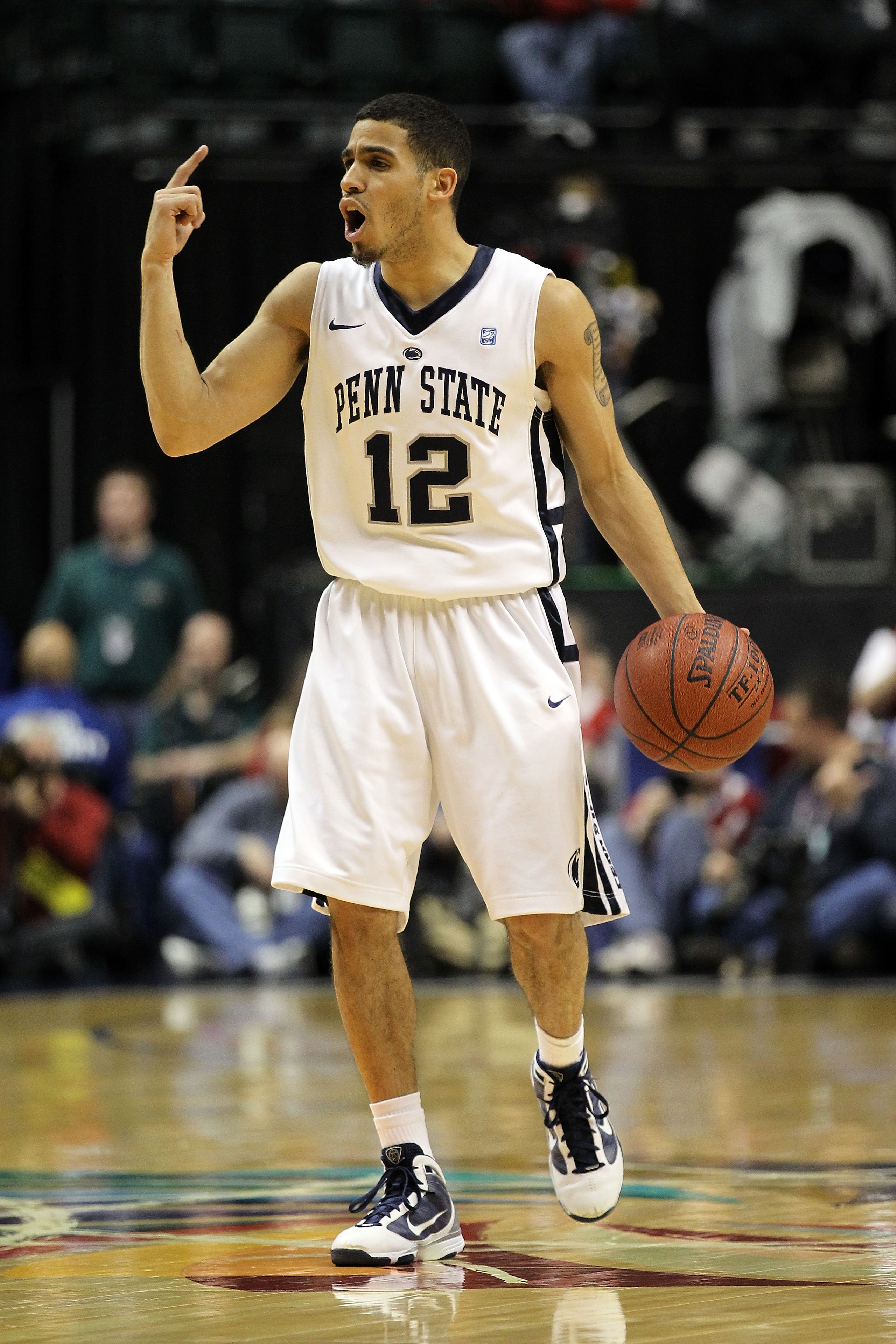 INDIANAPOLIS, IN - MARCH 10:  Talor Battle #12 of the Penn State Nittany Lions brings the ball up court against the Indiana Hoosiers during the first round of the 2011 Big Ten Men's Basketball Tournament at Conseco Fieldhouse on March 10, 2011 in Indianap