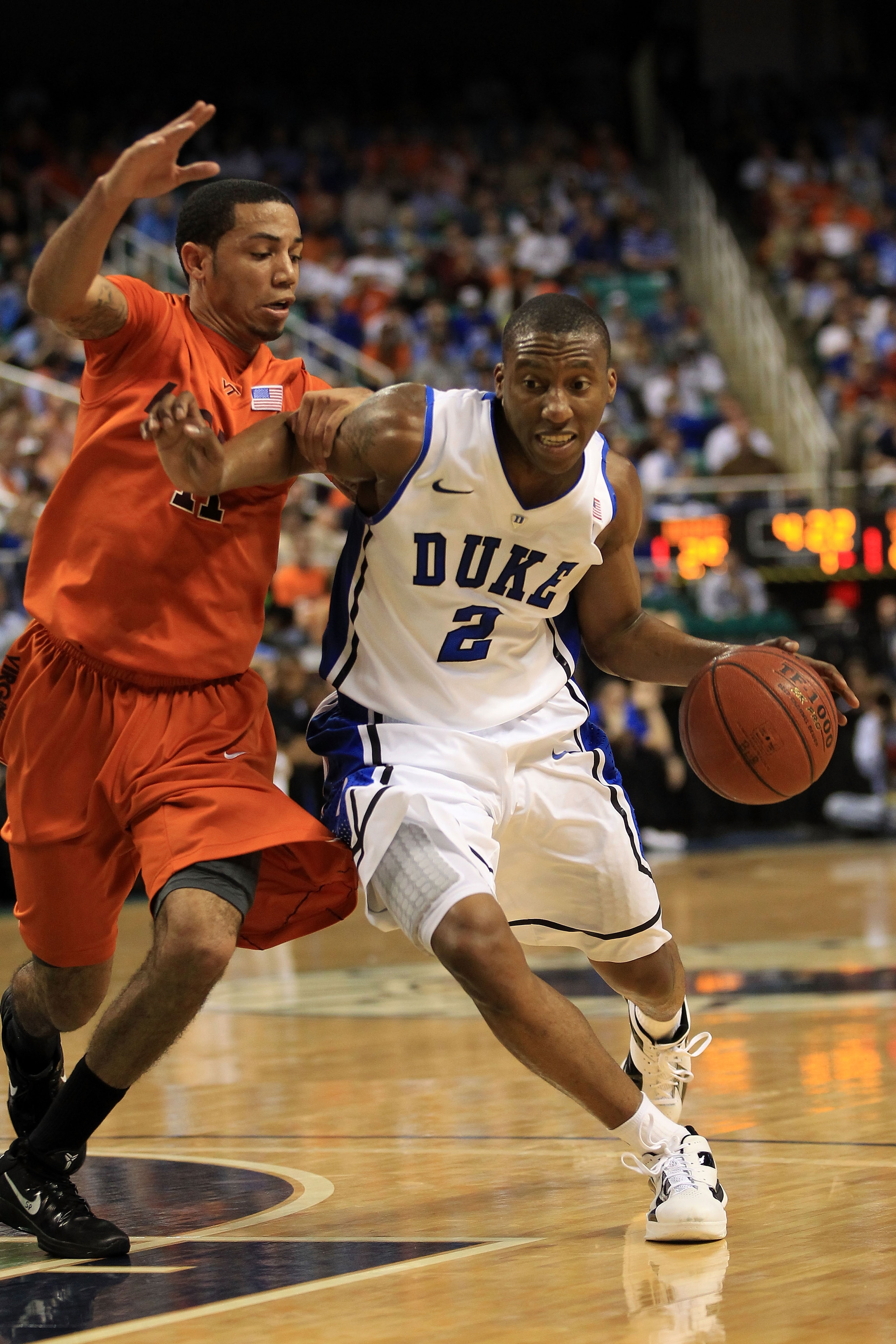 GREENSBORO, NC - MARCH 12:  Nolan Smith #2 of the Duke Blue Devils drives against Erick Green #11 of the Virginia Tech Hokies during the first half in the semifinals of the 2011 ACC men's basketball tournament at the Greensboro Coliseum on March 12, 2011
