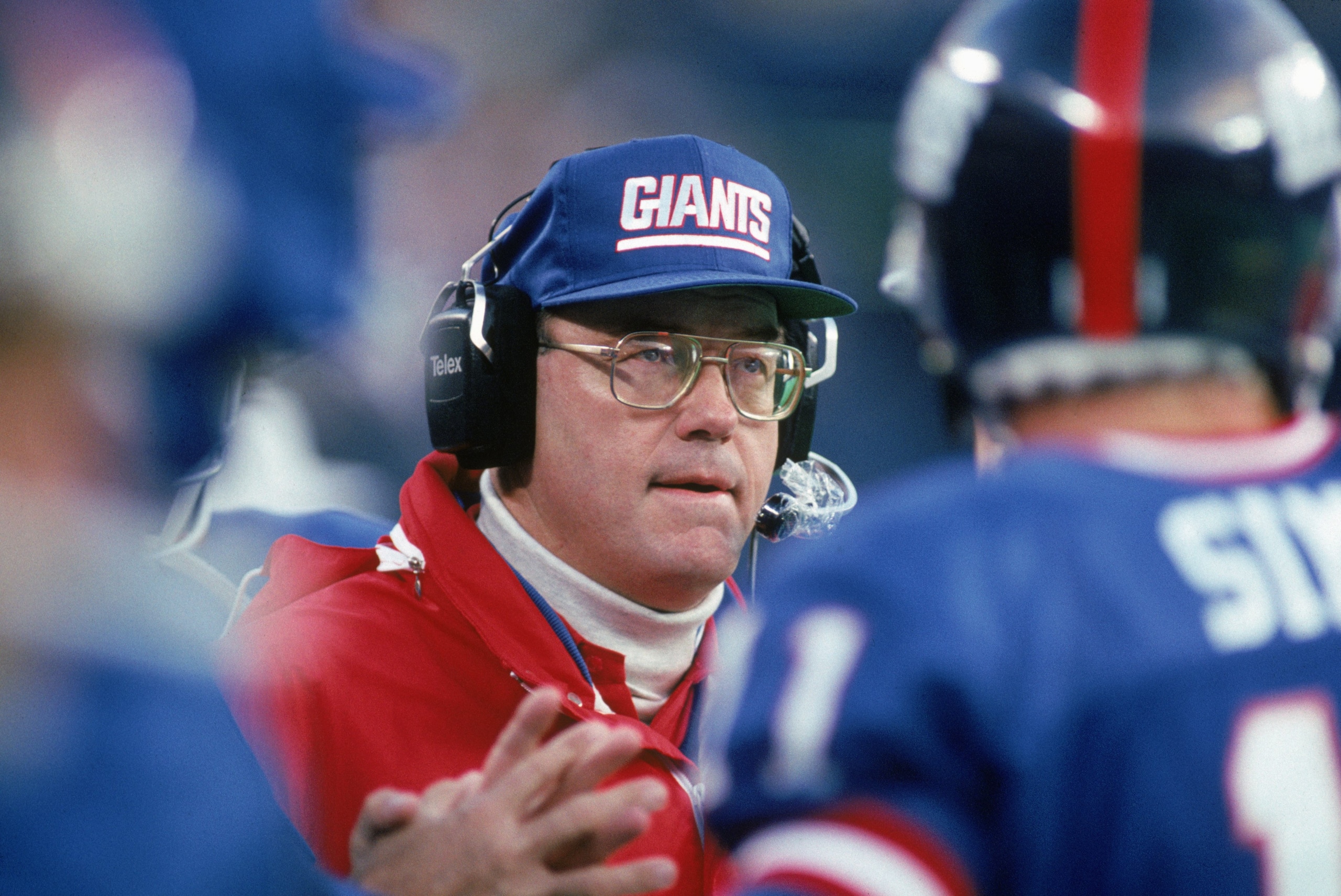 EAST RUTHERFORD, NJ - OCTOBER 28:  Running back coach Ray Handley of the New York Giants looks on during a game against the Washington Redskins at Giants Stadium October 28, 1990 in East Rutherford, New Jersey.  The Giants won 21-10.  (Photo by George Ros