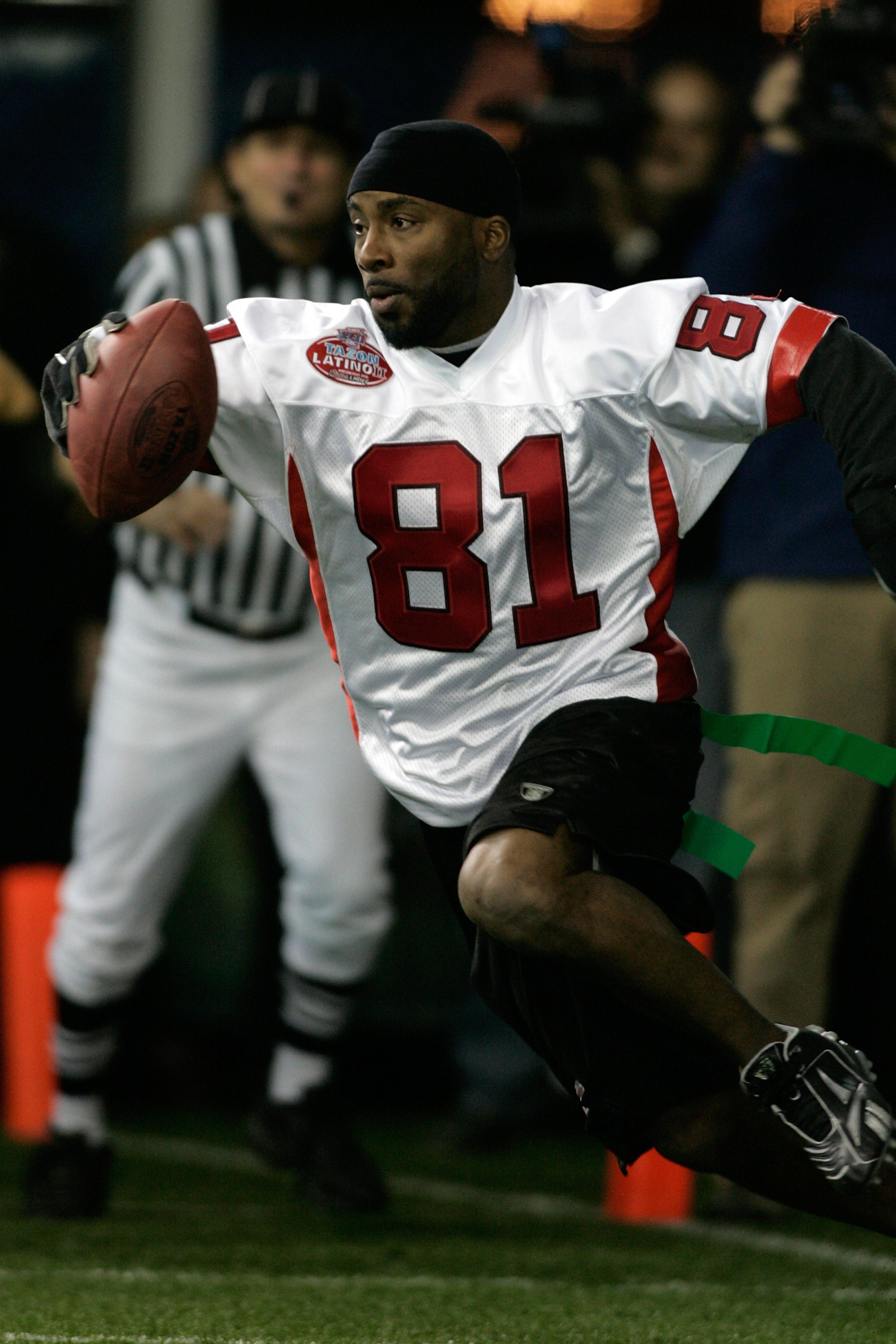 GLENDALE, AZ - JANUARY 30: Raghib 'Rocket' Ismail #81 of the Nacionales runs with the football against the Americanos during Tazon Latino II held at the NFL Experience on January 30, 2008 in Glendale, Arizona. The Nacionales defeated the Americanos 33-32.