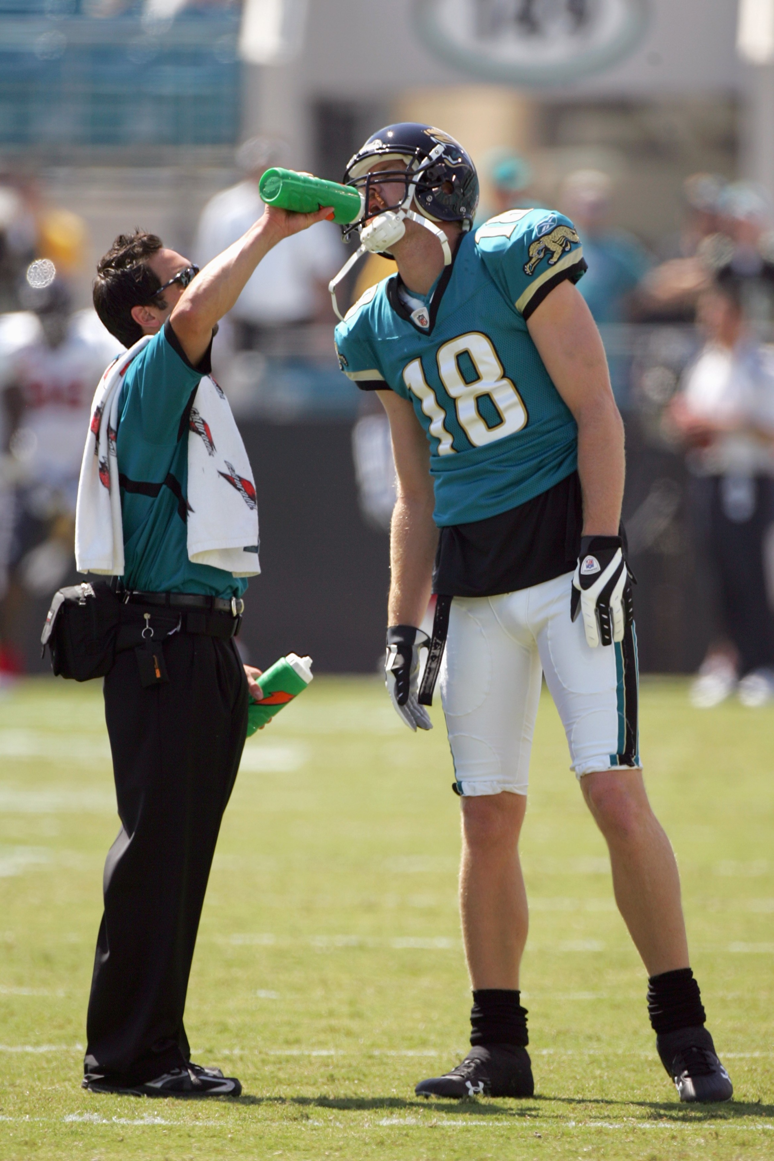 JACKSONVILLE, FL - SEPTEMBER 28:  Matt Jones #18 of the Jacksonville Jaguars is given a drink before the game against the Houston Texans at Jacksonville Municipal Stadium on September 28, 2008 in Jacksonville, Florida.  (Photo by Sam Greenwood/Getty Image
