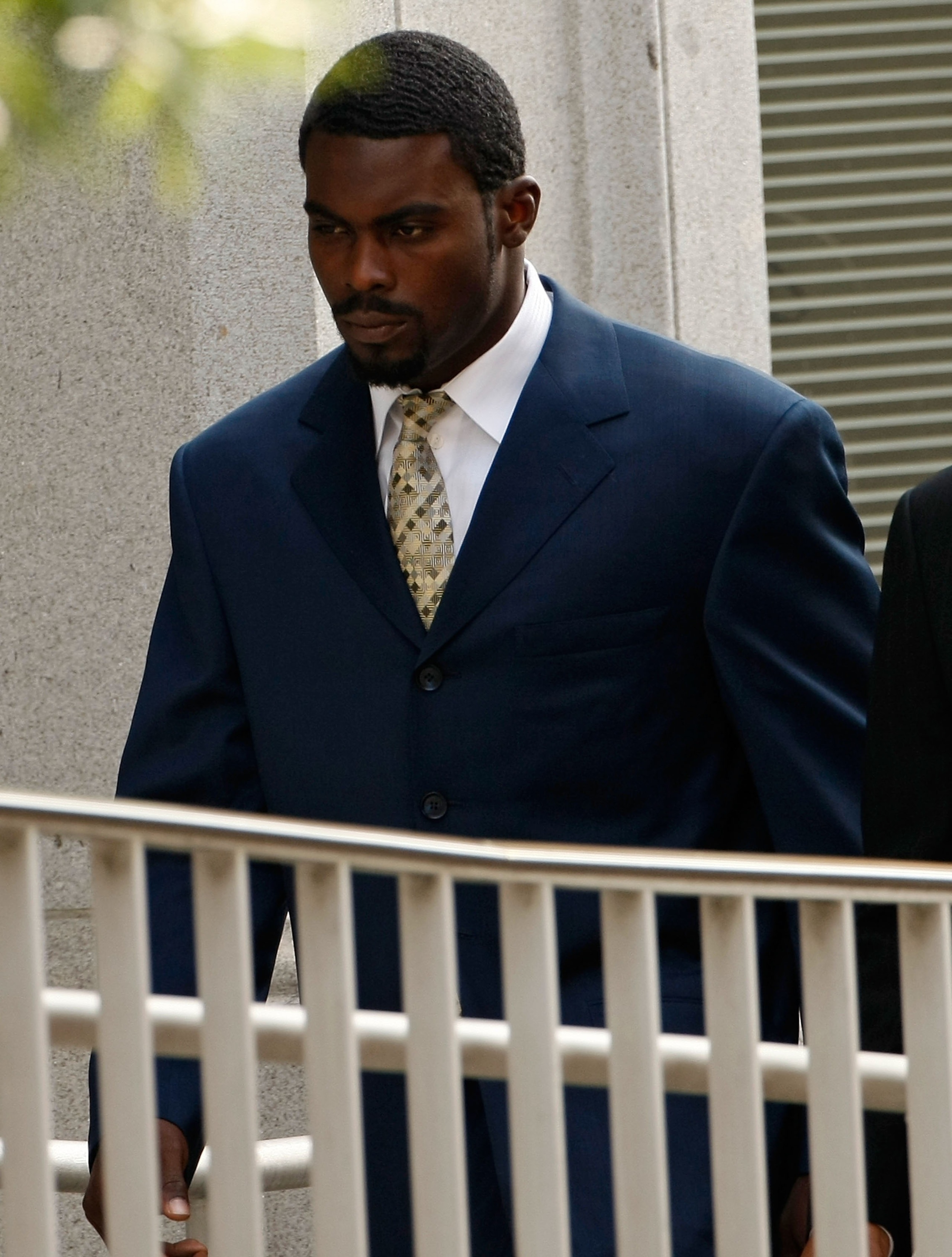 RICHMOND, VA - AUGUST 27:  Atlanta Falcons quarterback Michael Vick (L) arrives at federal court August 27, 2007 in Richmond, Virginia. The football star was expected to plead guilty to a federal dogfighting conspiracy charge. The NFL has suspended Vick i