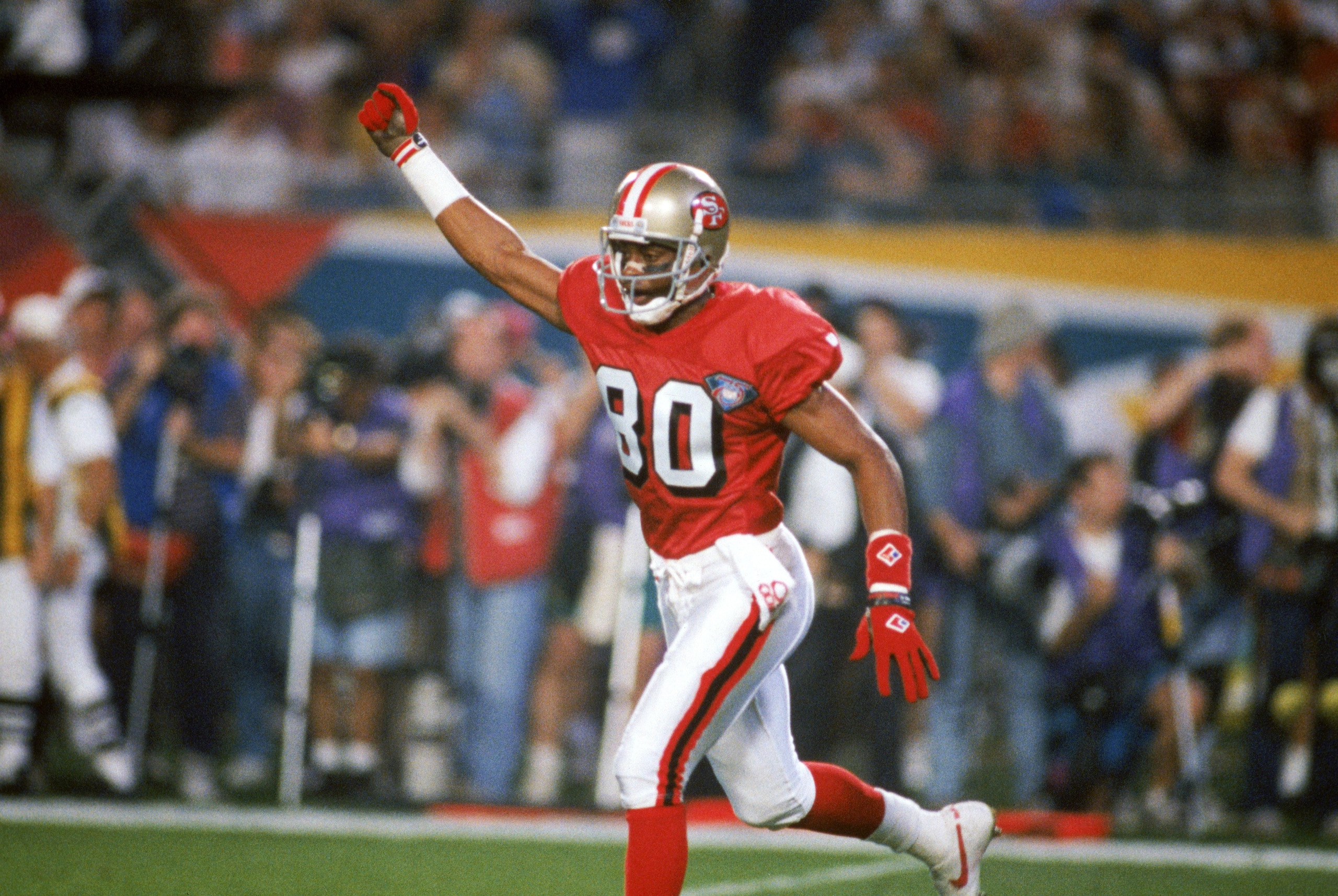 MIAMI - JANUARY 29:  Wide receiver Jerry Rice #80 of the San Francisco 49ers celebrates during Super Bowl XXIX against the San Diego Chargers at Joe Robbie Stadium on January 29, 1995 in Miami, Florida.  The 49ers won 49-26. (Photo by George Rose/Getty Im