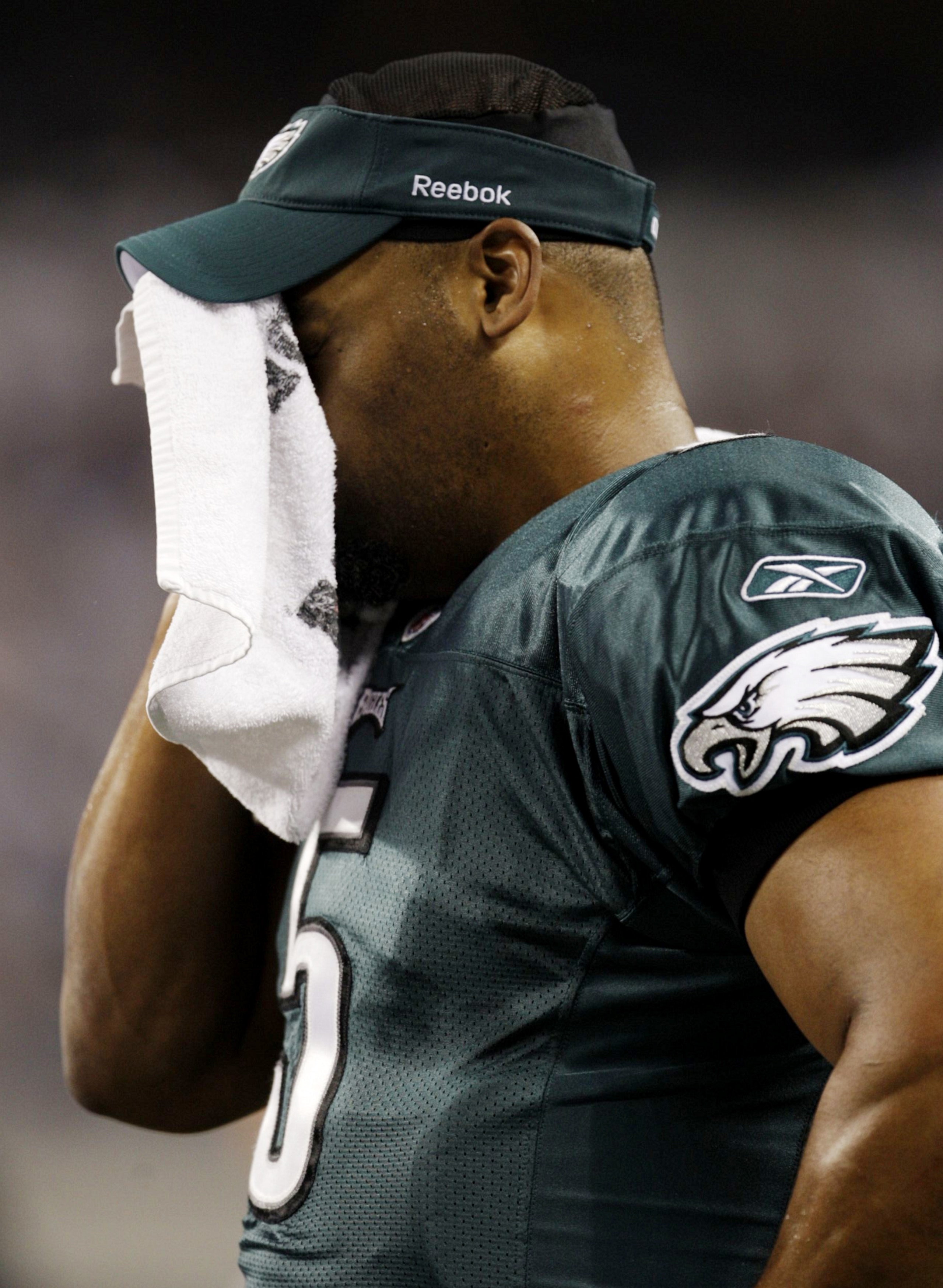 ARLINGTON, TX - JANUARY 9:  Quarterback Donovan McNabb #5 of the Philadelphia Eagles wipes his face from the sideline in the second quarter against the Dallas Cowboys during the 2010 NFC wild-card playoff game at Cowboys Stadium on January 9, 2010 in Arli