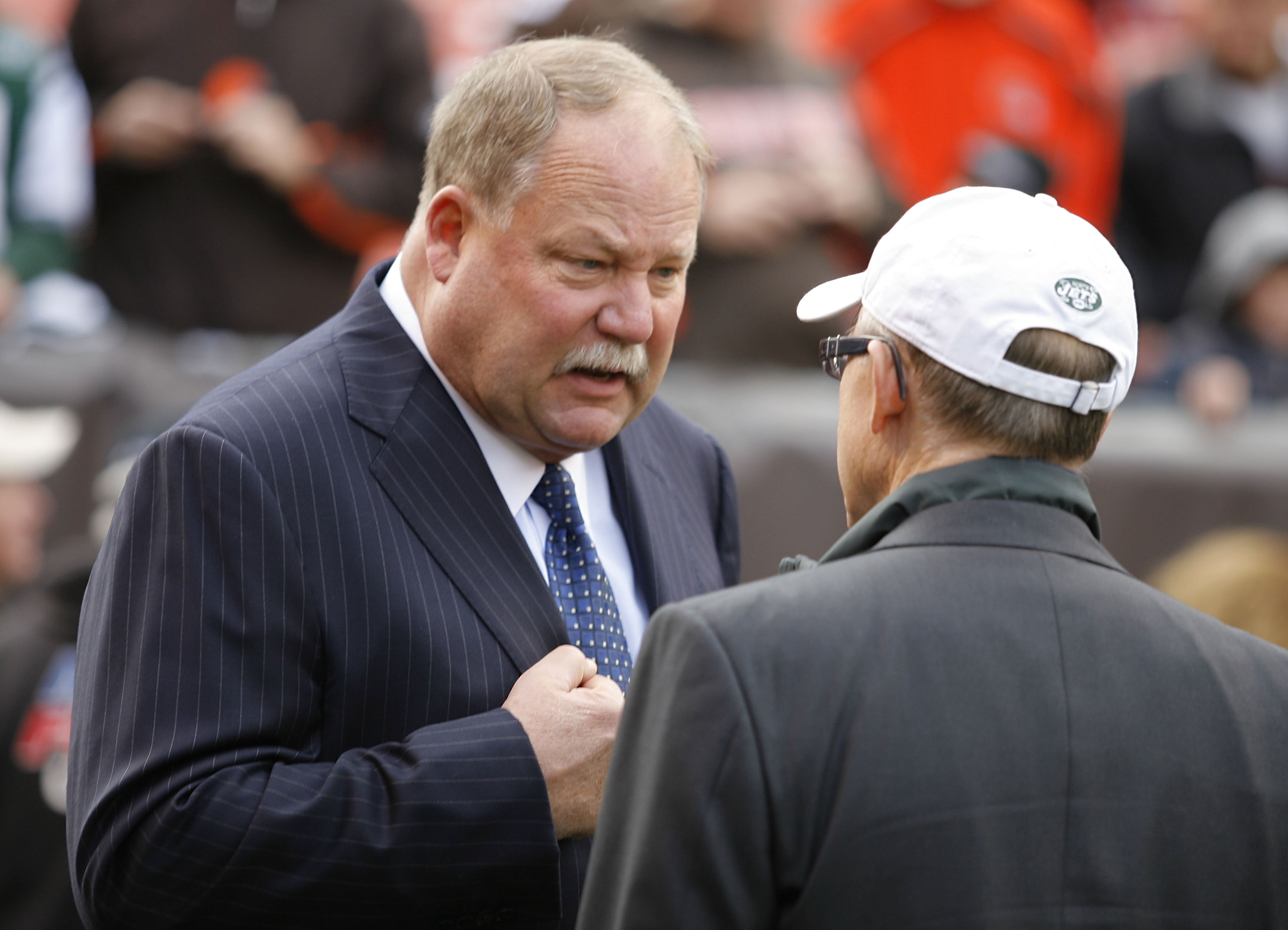 CLEVELAND - NOVEMBER 14: Owner Woody Johnson of the New York Jets talks with general manager Mike Holmgren of the Cleveland Browns prior to the start of their game at Cleveland Browns Stadium on November 14, 2010 in Cleveland, Ohio. (Photo by Matt Sulli CLEVELAND - NOVEMBER 14: Owner Woody Johnson of the New York Jets talks with general manager Mike Holmgren of the Cleveland Browns prior to the start of their game at Cleveland Browns Stadium on November 14, 2010 in Cleveland, Ohio. (Photo by Matt Sulli