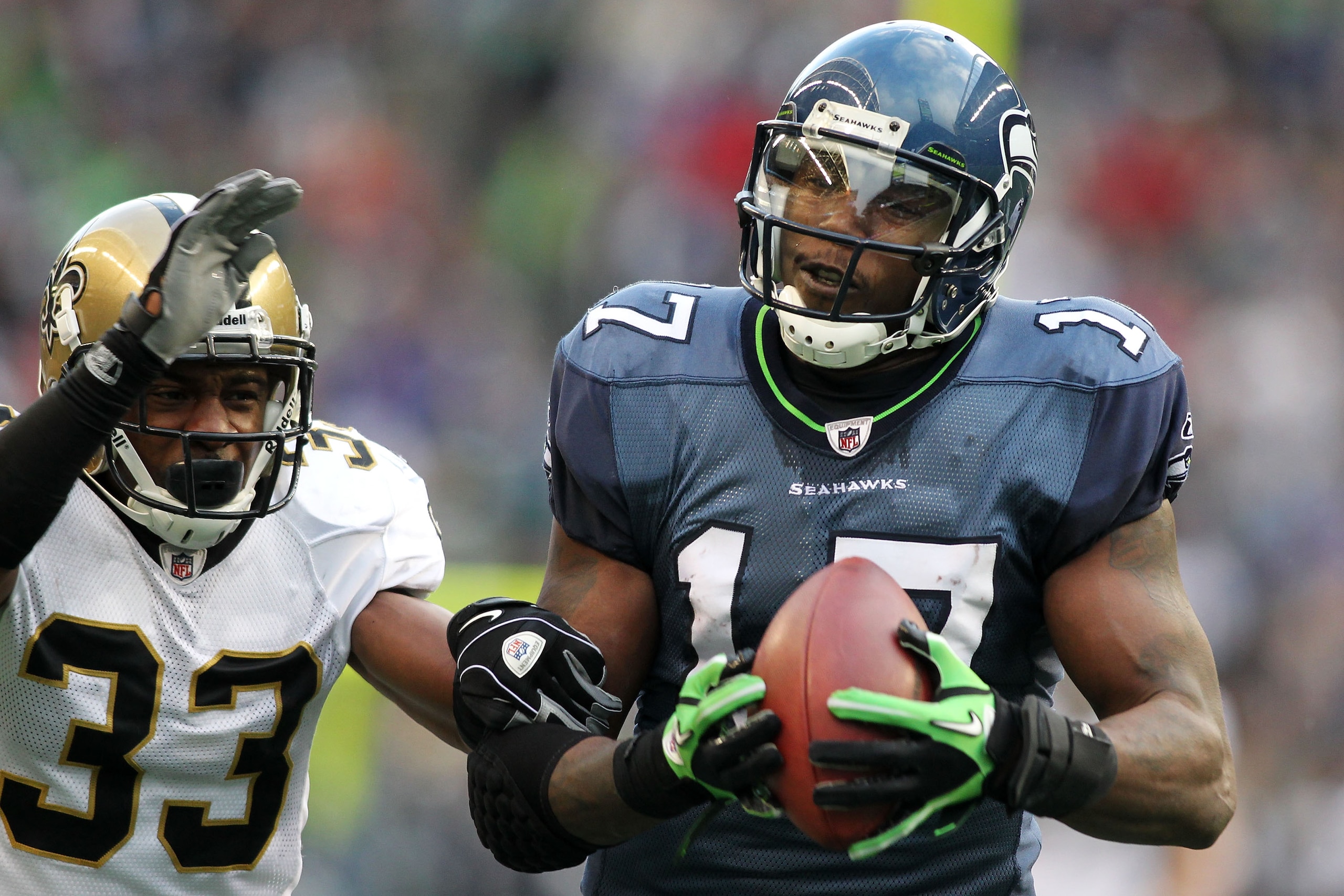 SEATTLE, WA - JANUARY 08:  Mike Williams #17 of the Seattle Seahawks completes a reception over Jabari Greer #33 of the New Orleans Saints during the 2011 NFC wild-card playoff game at Qwest Field on January 8, 2011 in Seattle, Washington.  (Photo by Jona