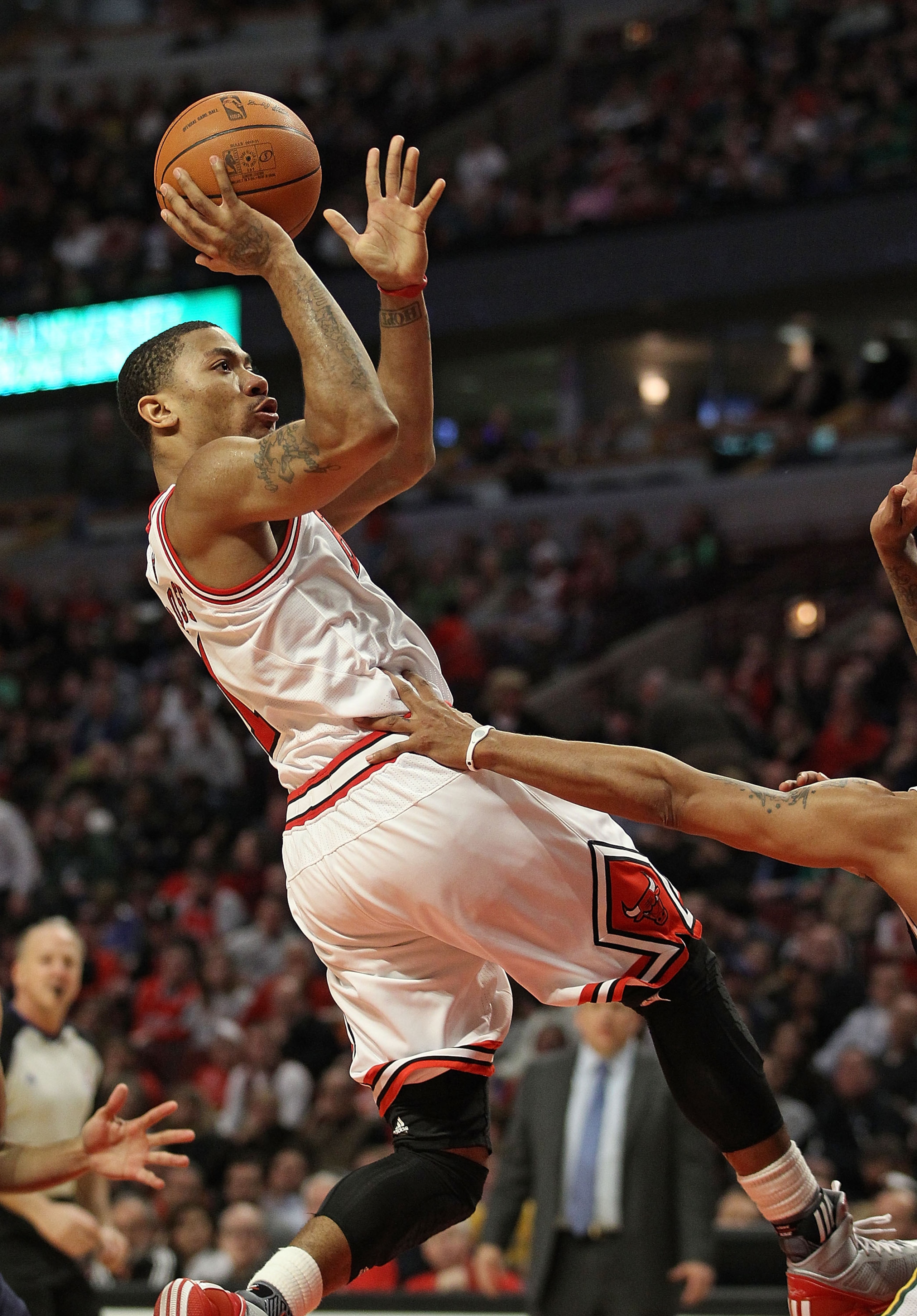 CHICAGO, IL - MARCH 12: Derrick Rose #1 of the Chicago Bulls puts up a shot against the Utah Jazz at the United Center on March 12, 2011 in Chicago, Illinois. The Bulls defeated the Jazz 118-100. NOTE TO USER: User expressly acknowledges and agrees that,