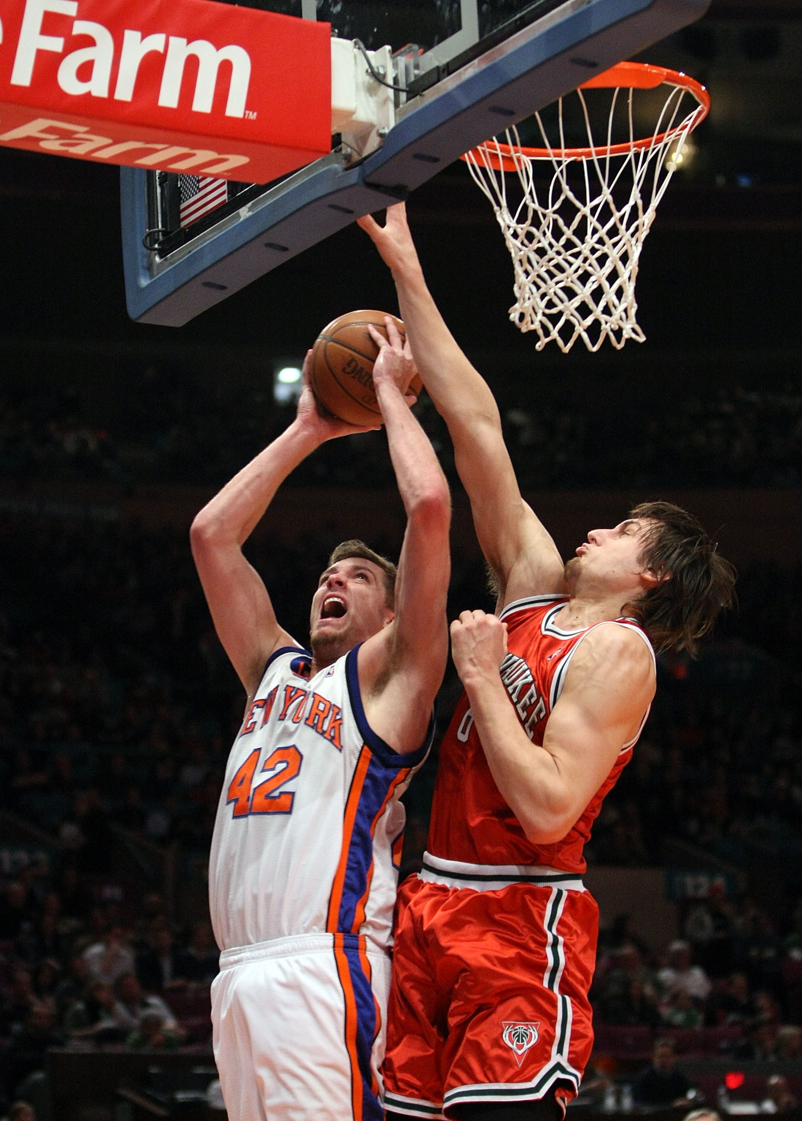 NEW YORK - DECEMBER 19: Andrew Bogut #6 of the Milwaukee Bucks blocks the shot of David Lee #42 of the New York Knicks on December 19, 2008 at Madison Square Garden in New York City, New York. NOTE TO USER: User expressly acknowledges and agrees that, by