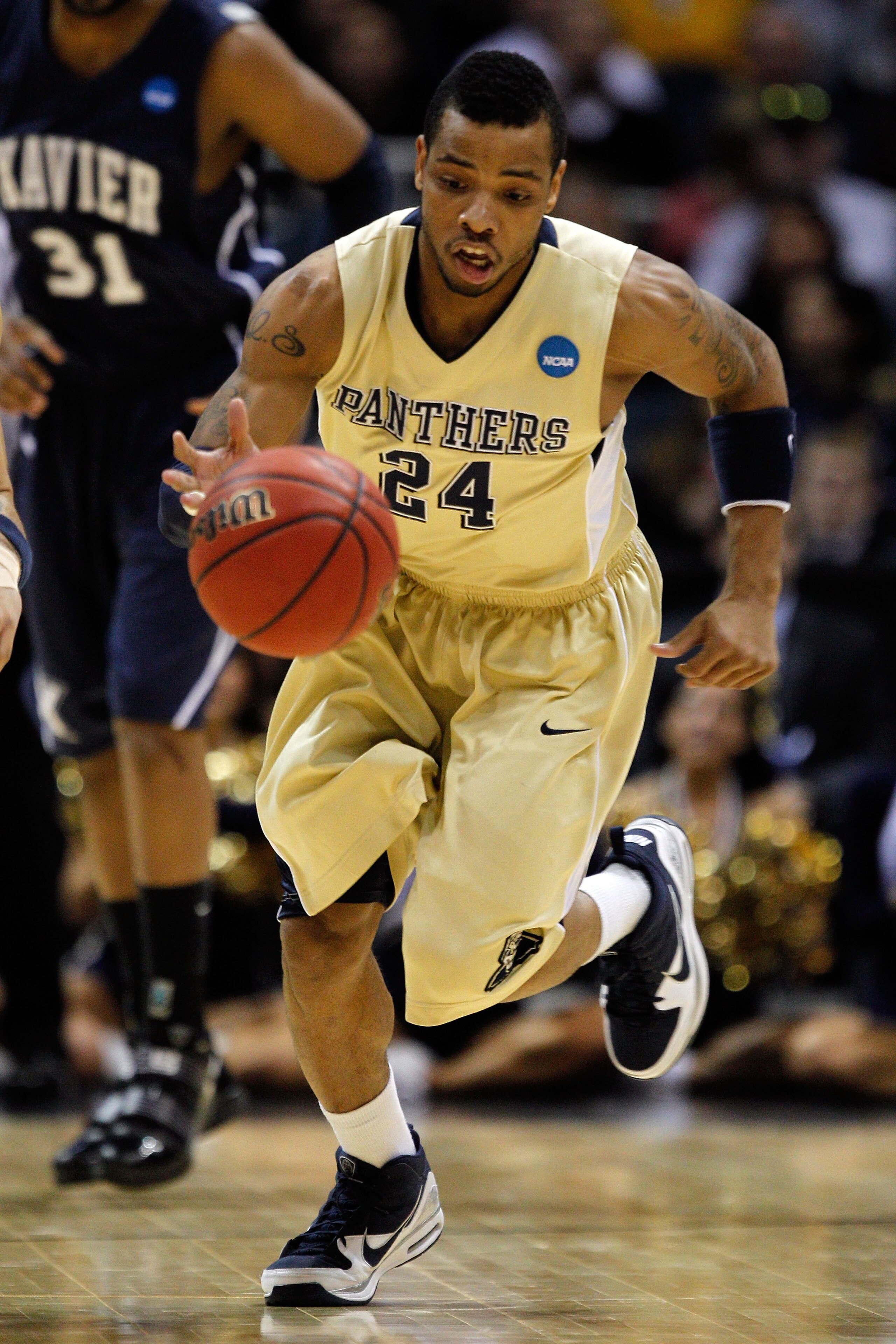 MILWAUKEE - MARCH 21:  Jermaine Dixon #24 of the Pittsburgh Panthers moves the ball against the Xavier Musketeers during the second round of the 2010 NCAA men's basketball tournament at the Bradley Center on March 21, 2010 in Milwaukee, Wisconsin.  (Photo