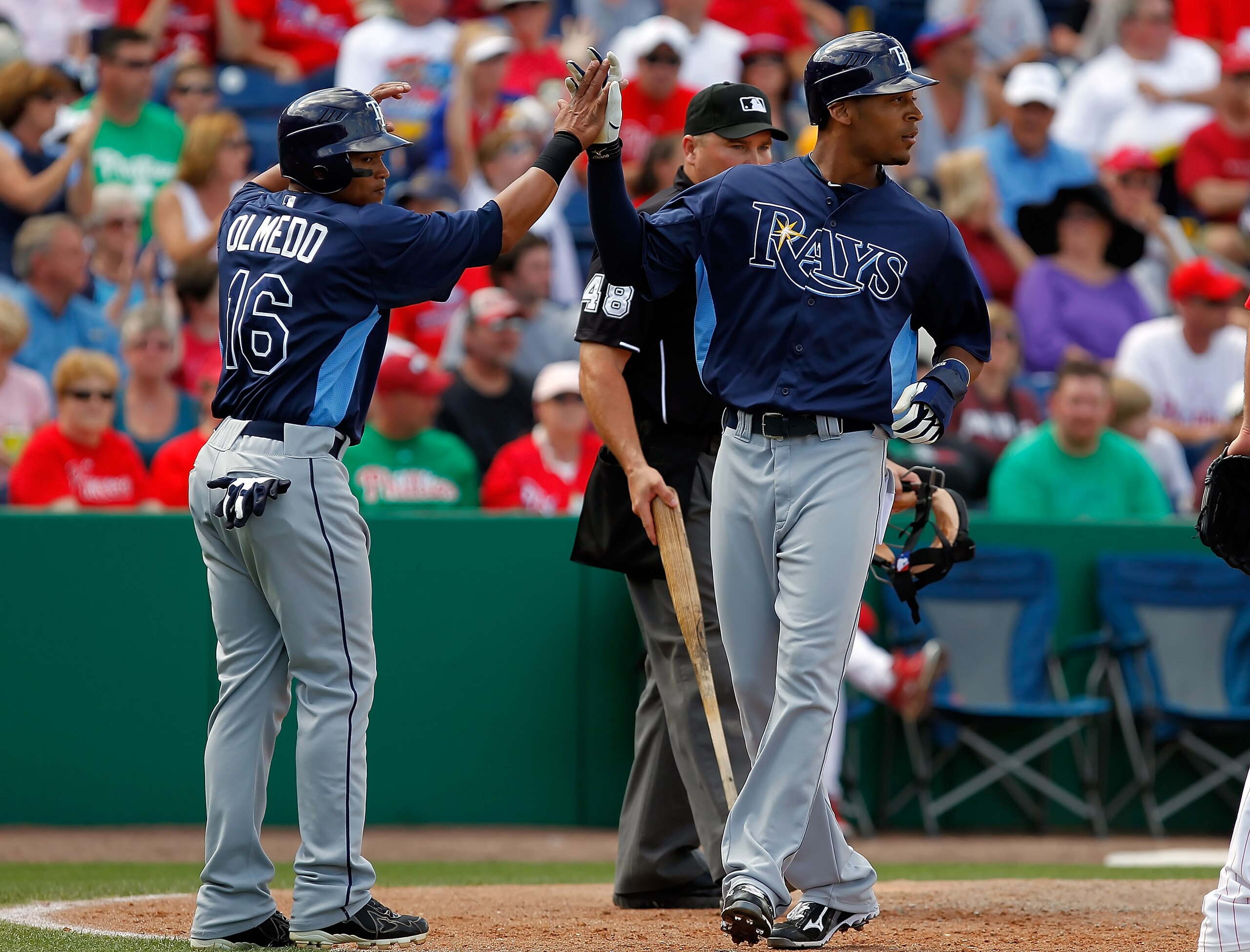 CLEARWATER, FL - MARCH 06:  Outfielder Desmond Jennings #8 of the Tampa Bay Rays is congratulated by teammate Ray Olmedo #16 after scoring a run against the Philadelphia Phillies during a Grapefruit League Spring Training Game at Bright House Field on Mar