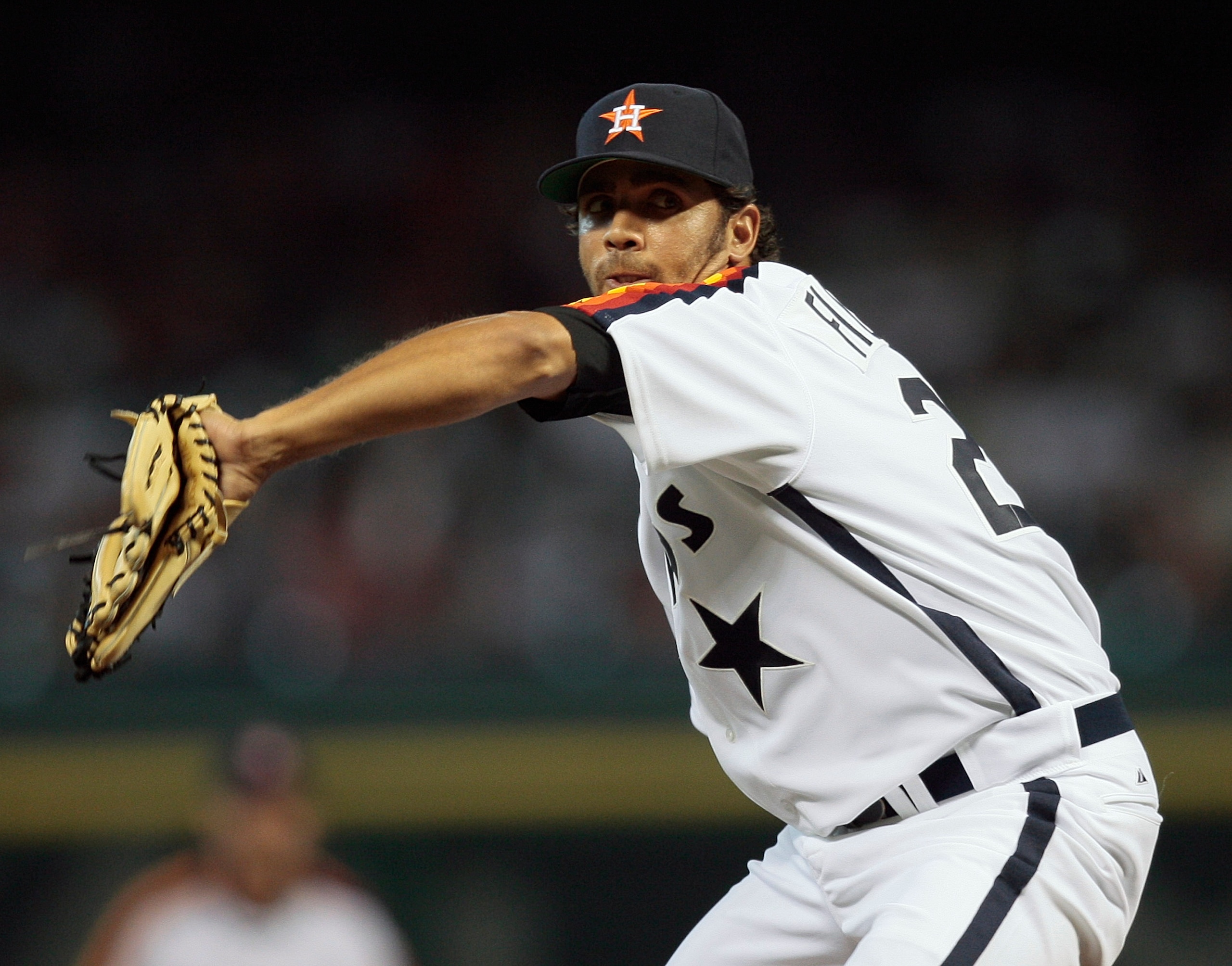 HOUSTON - JULY 24:  Pitcher Nelson Figueroa #28 of the Houston Astros throws against the Cincinnati Reds at Minute Maid Park on July 24, 2010 in Houston, Texas.  (Photo by Bob Levey/Getty Images)