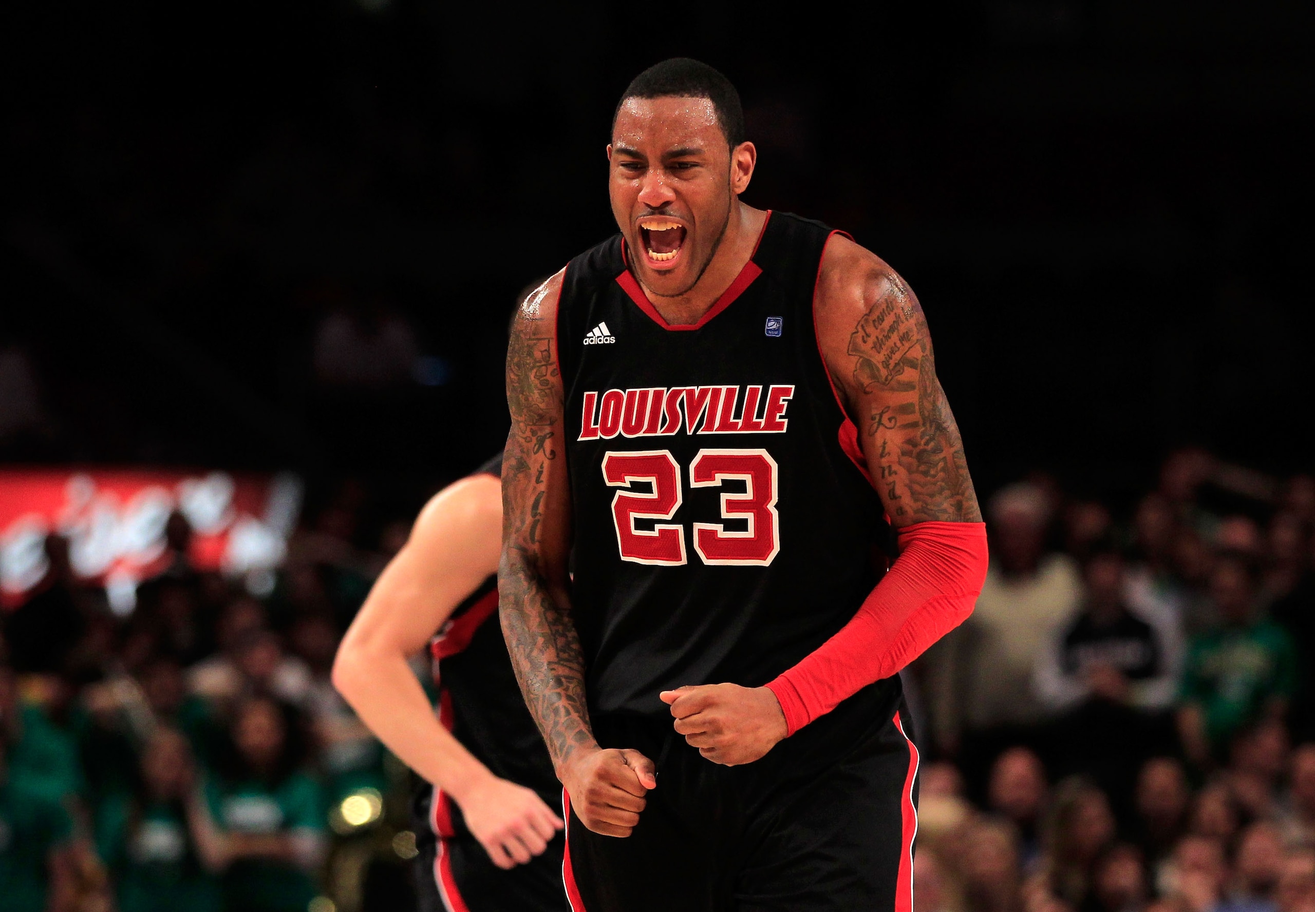 NEW YORK, NY - MARCH 11:  Terrence Jennings #23 of the Louisville Cardinals celebrates after a play late in the second half against Notre Dame Fighting Irish during the semifinals of the 2011 Big East Men's Basketball Tournament presented by American Eagl