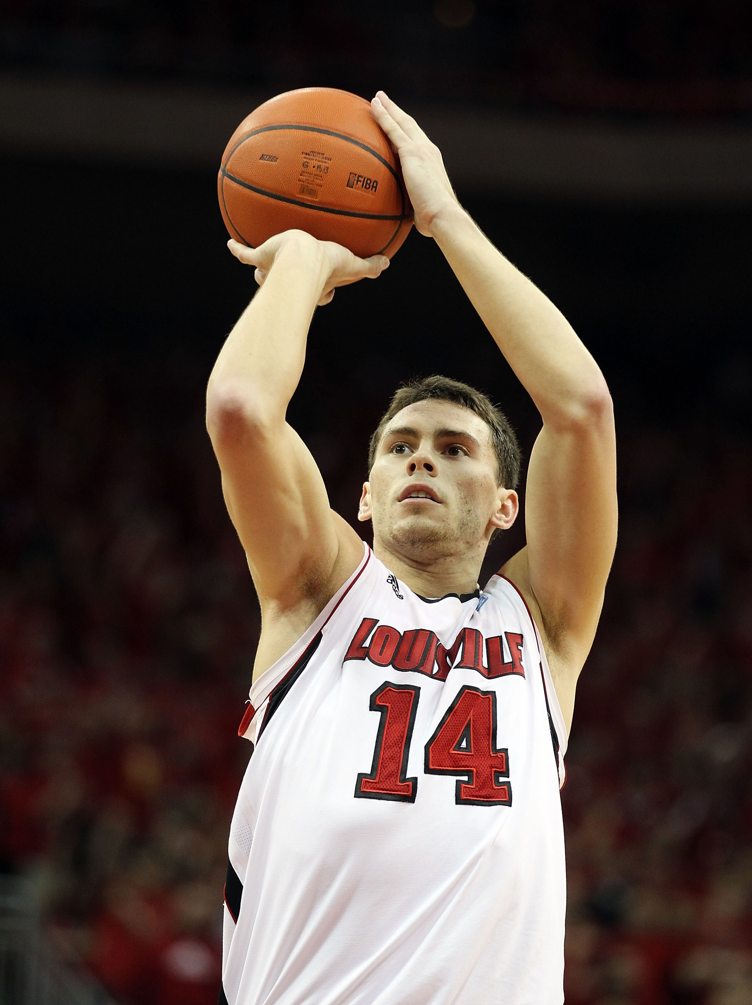 LOUISVILLE, KY - MARCH 02:  Kyle Kuric #14 of the Louisville Cardinals shoots the ball during the Big East Conference game against the Providence Friars at the KFC Yum! Center on March 2, 2011 in Louisville, Kentucky. Louisville won 87-60.  (Photo by Andy